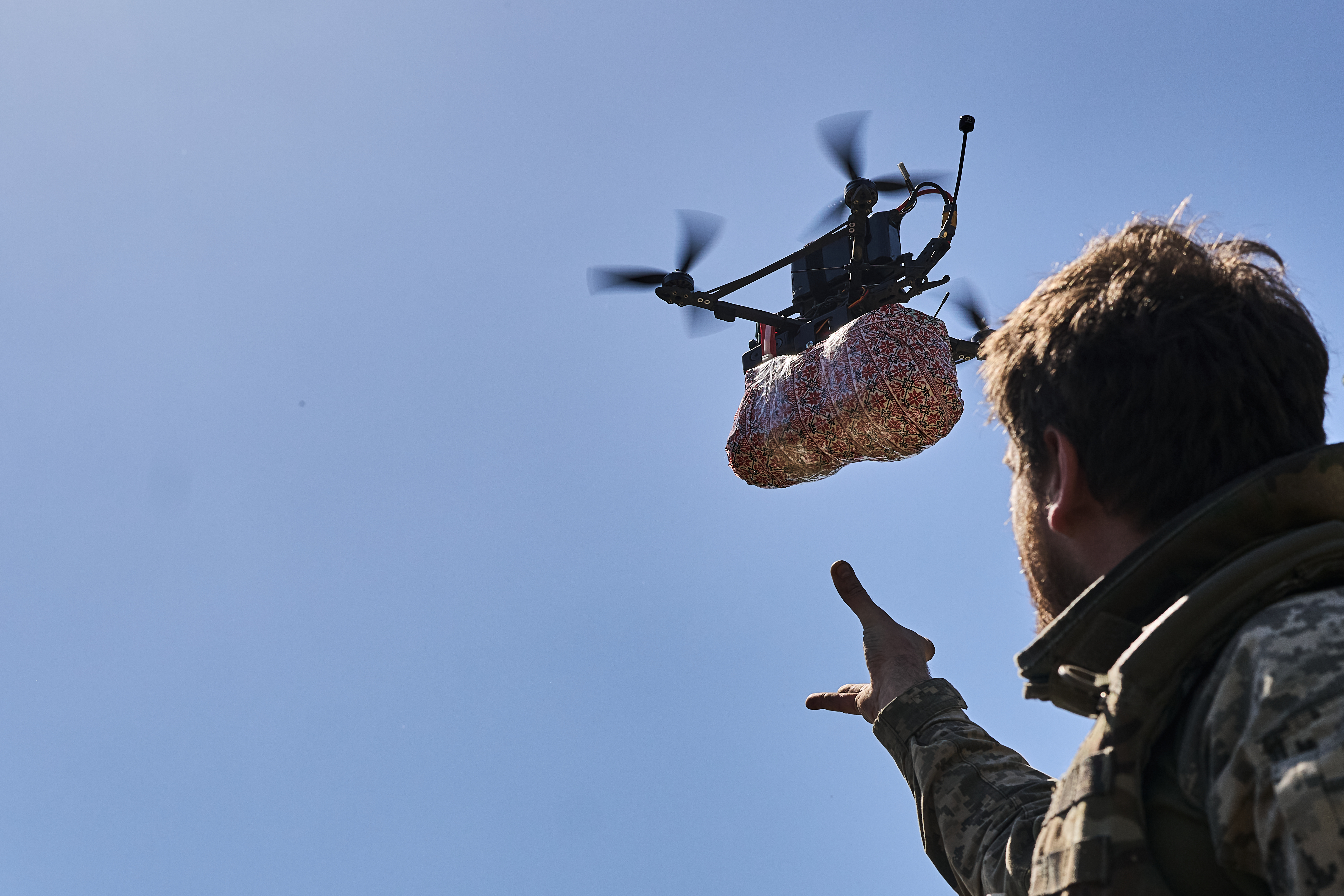 KHERSON REGION, UKRAINE - MAY 5: A soldier of the 126th Territorial Defense Brigade, who is fighting on the southern front of Ukraine, prepares to send out Easter cake delivered by FPV drone for soldiers who hold positions on the left bank of the Dnipro River