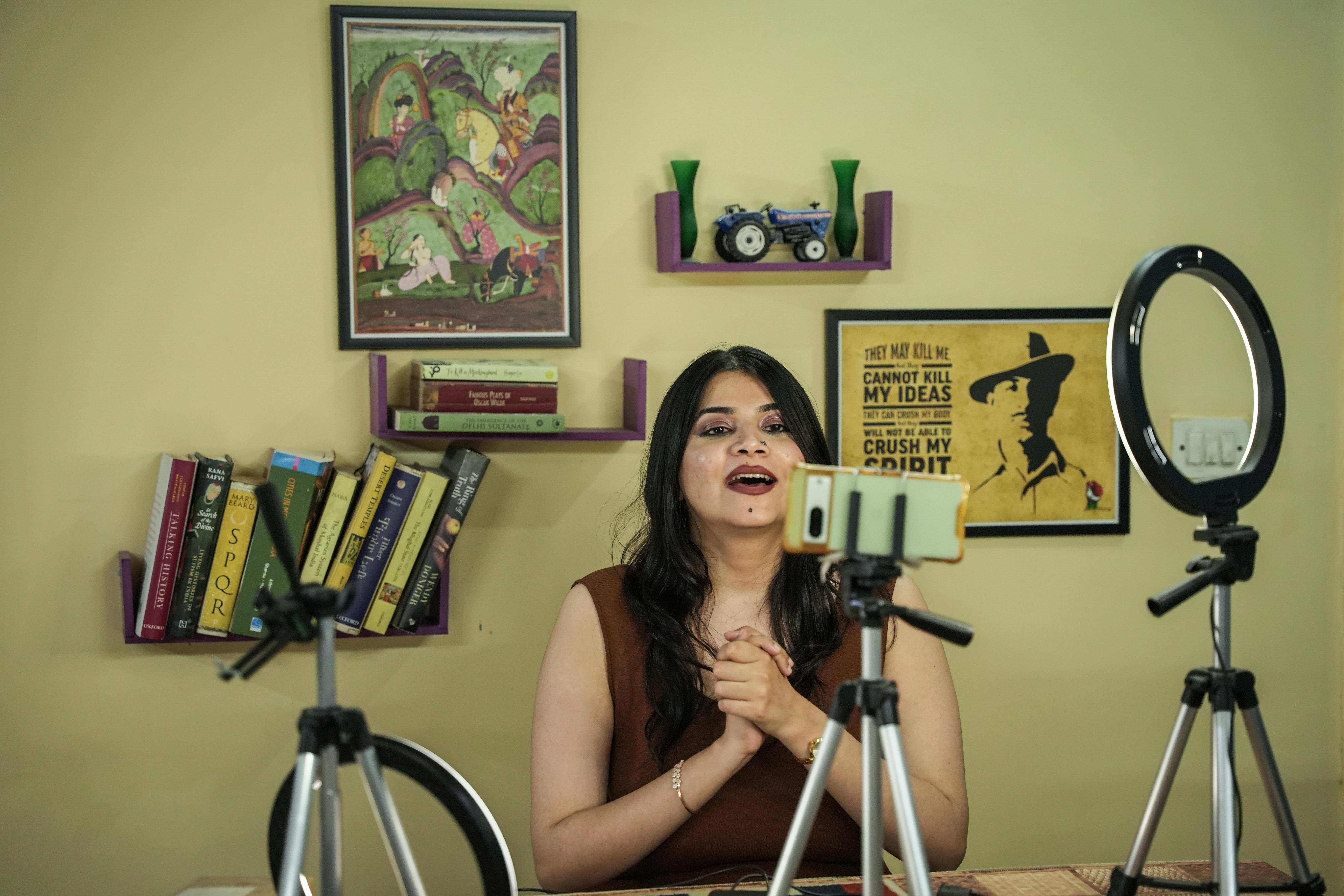 Ruchika Sharma, 33, a historian, recording a video for her history YouTube channel. (Md Meharban/Al Jazeera)
