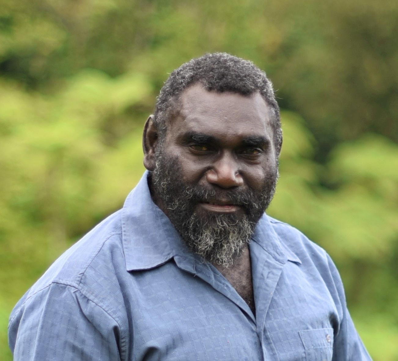 A head and shoulders photograph of Bougainville president Ishmael Toroama. He is wearing a pale blue open-necked shirt.