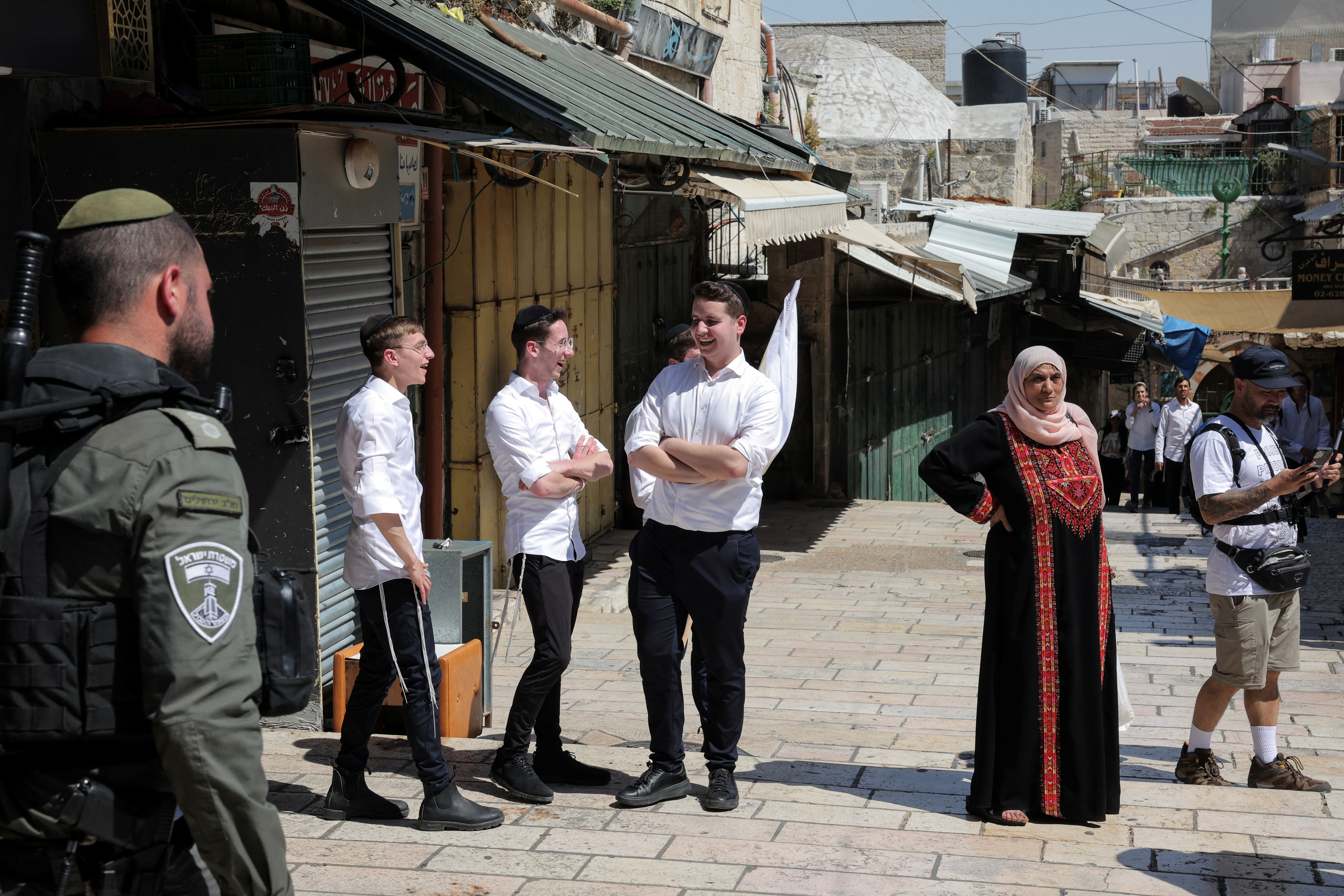 Israelis march through the alleyways of Jerusalem's Old City to the Western Wall, waving Israeli flags on 'Jerusalem Day' to commemorate the establishment of Israeli control over the city.
