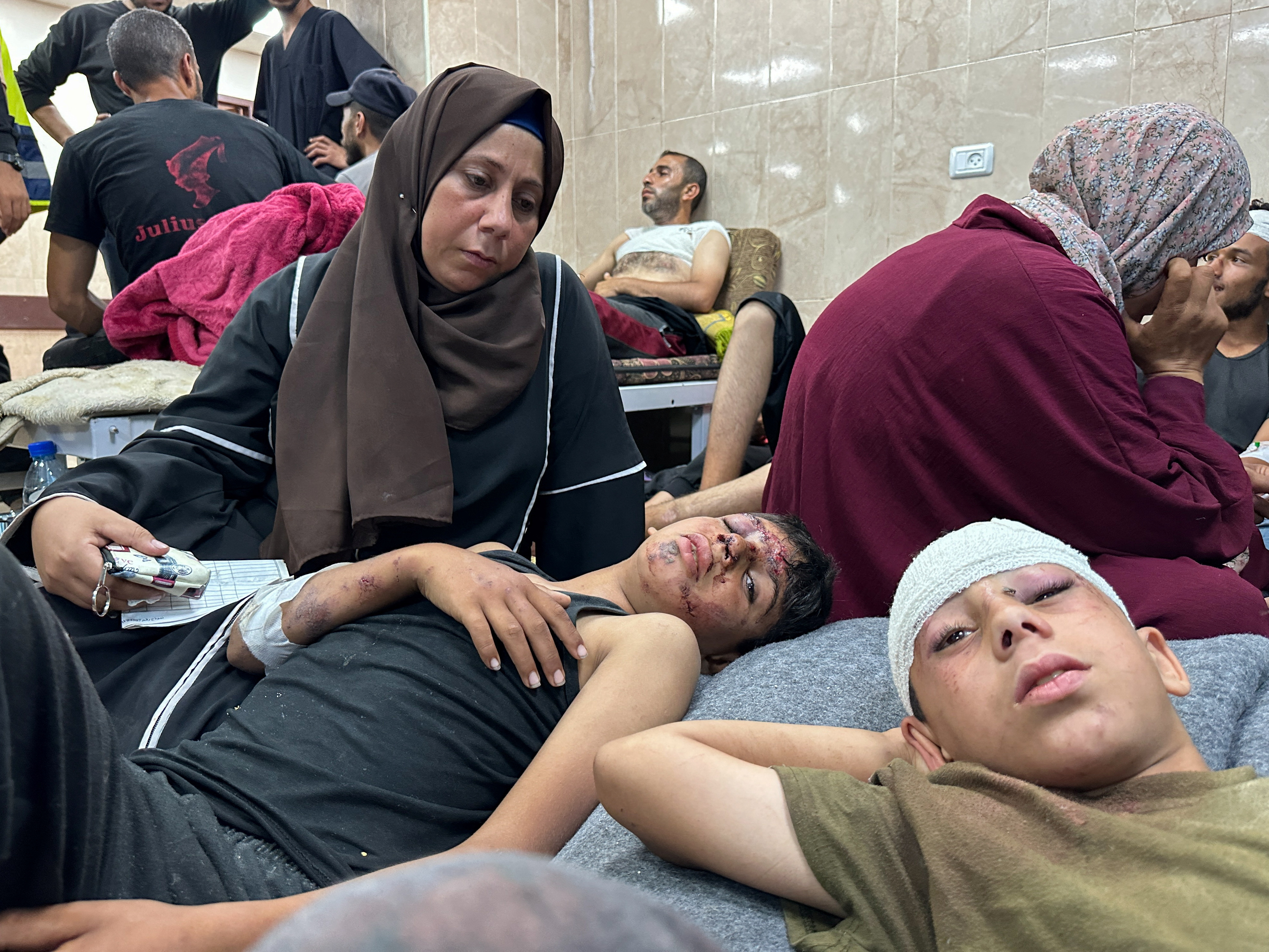 Palestinian children injured in an Israeli strike on a UNRWA school shelter at Al-Aqsa Hospital in Deir Al-Balah, in central Gaza, June 6, 2024. [Doaa Rouqa/Reuters]
