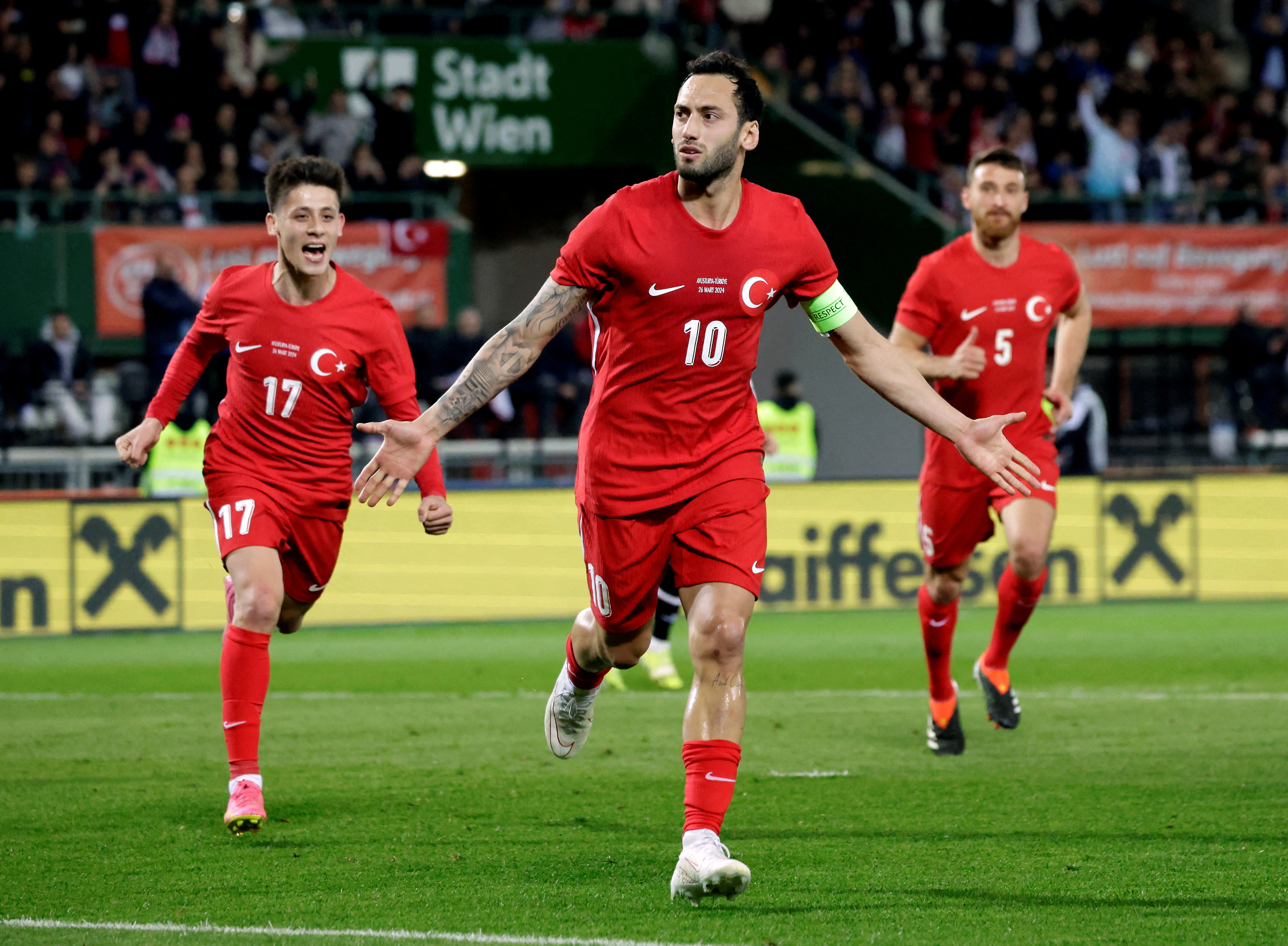Football players celebrating goal.