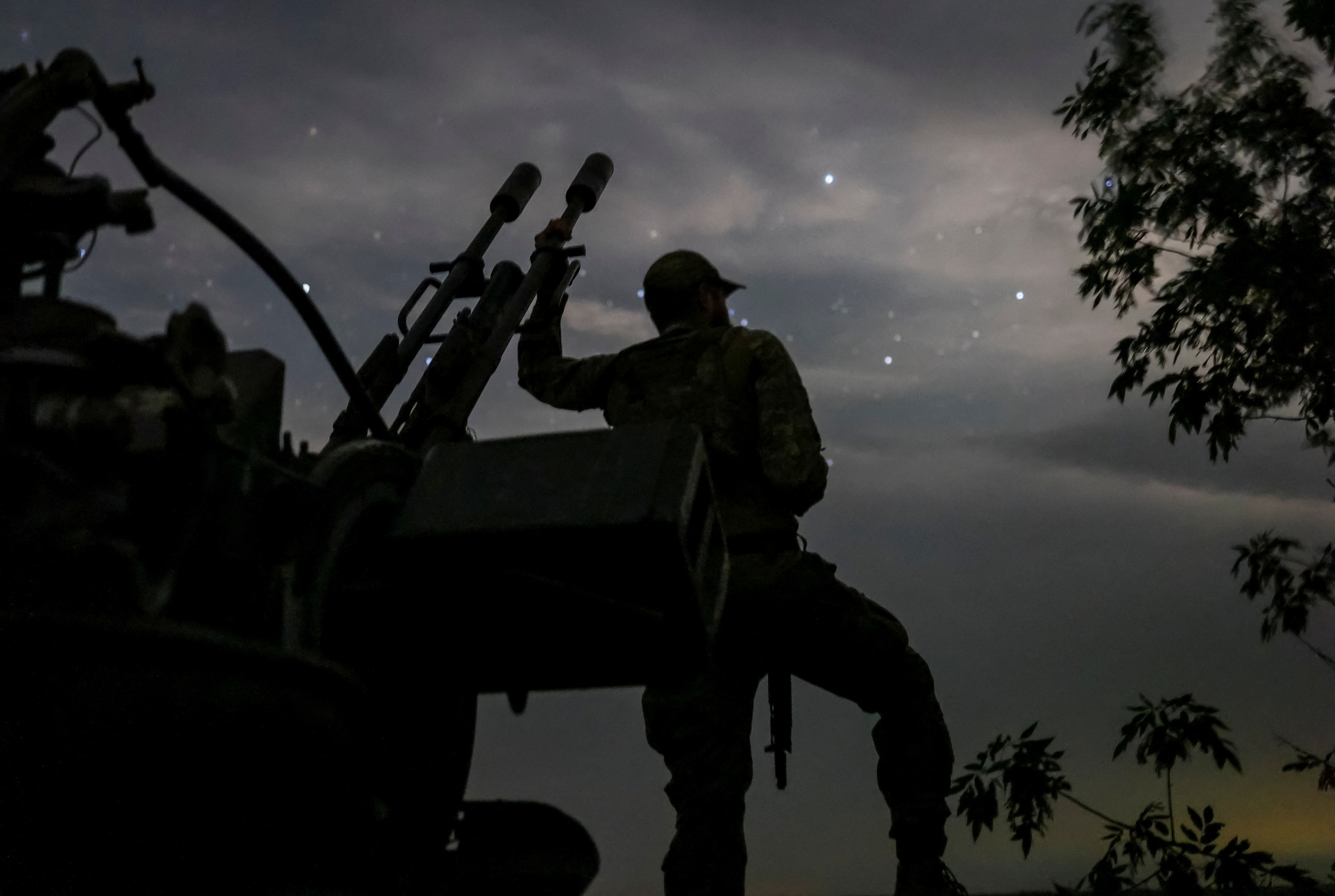 A Ukrainian serviceman from an anti-drone mobile air defence unit stands near a ZU-23-2 anti aircraft cannon as he waits for Russian kamikaze drones, amid Russia's attack on Ukraine, in Kherson region, Ukraine June 11, 2024. REUTERS/Ivan Antypenko