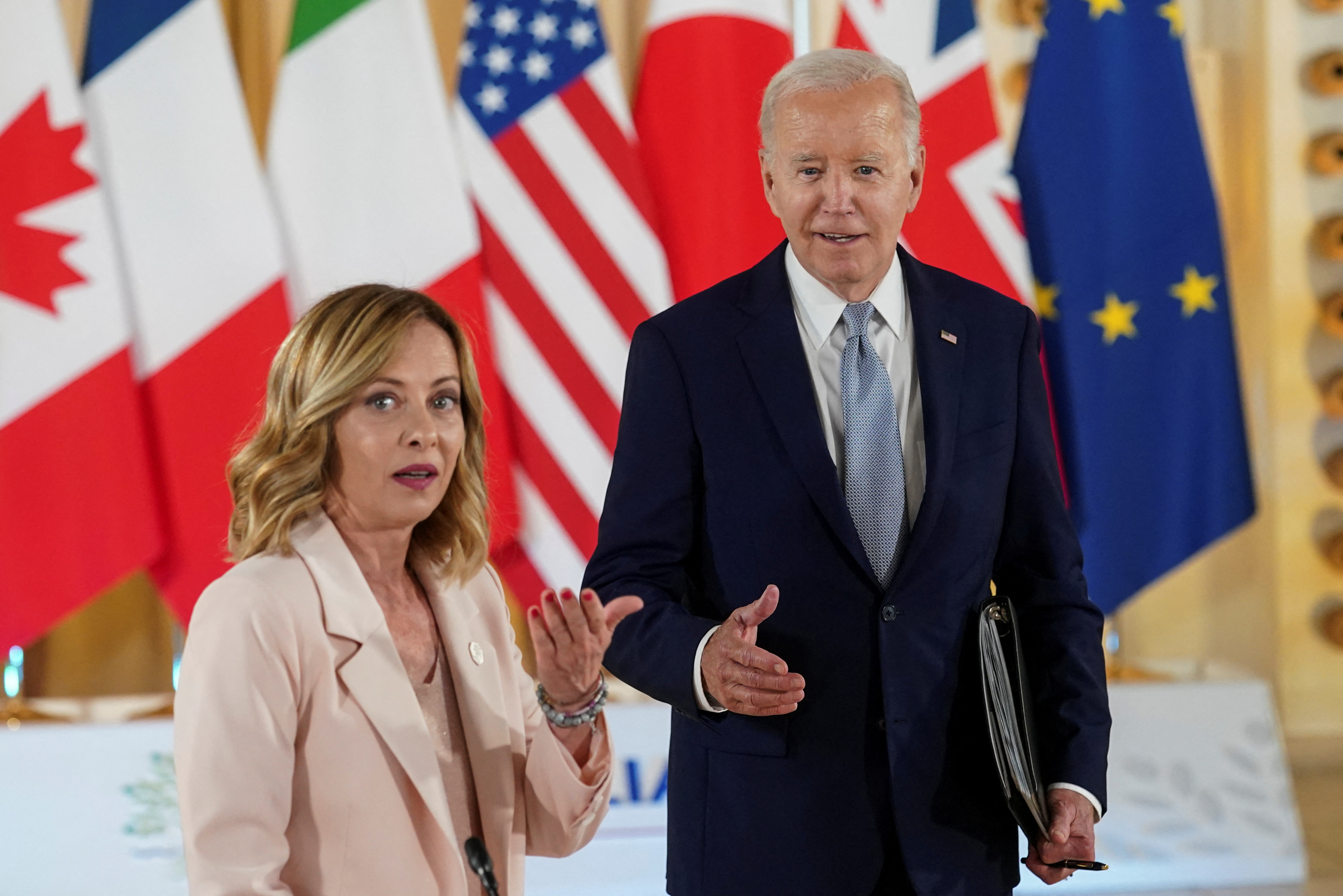 Italian Prime Minister Giorgia Meloni and U.S. President Joe Biden attend Partnership for Global Infrastructure and Investment (PGII) event on the first day of the G7 summit, in Savelletri, Italy, June 13, 2024. REUTERS/Kevin Lamarque