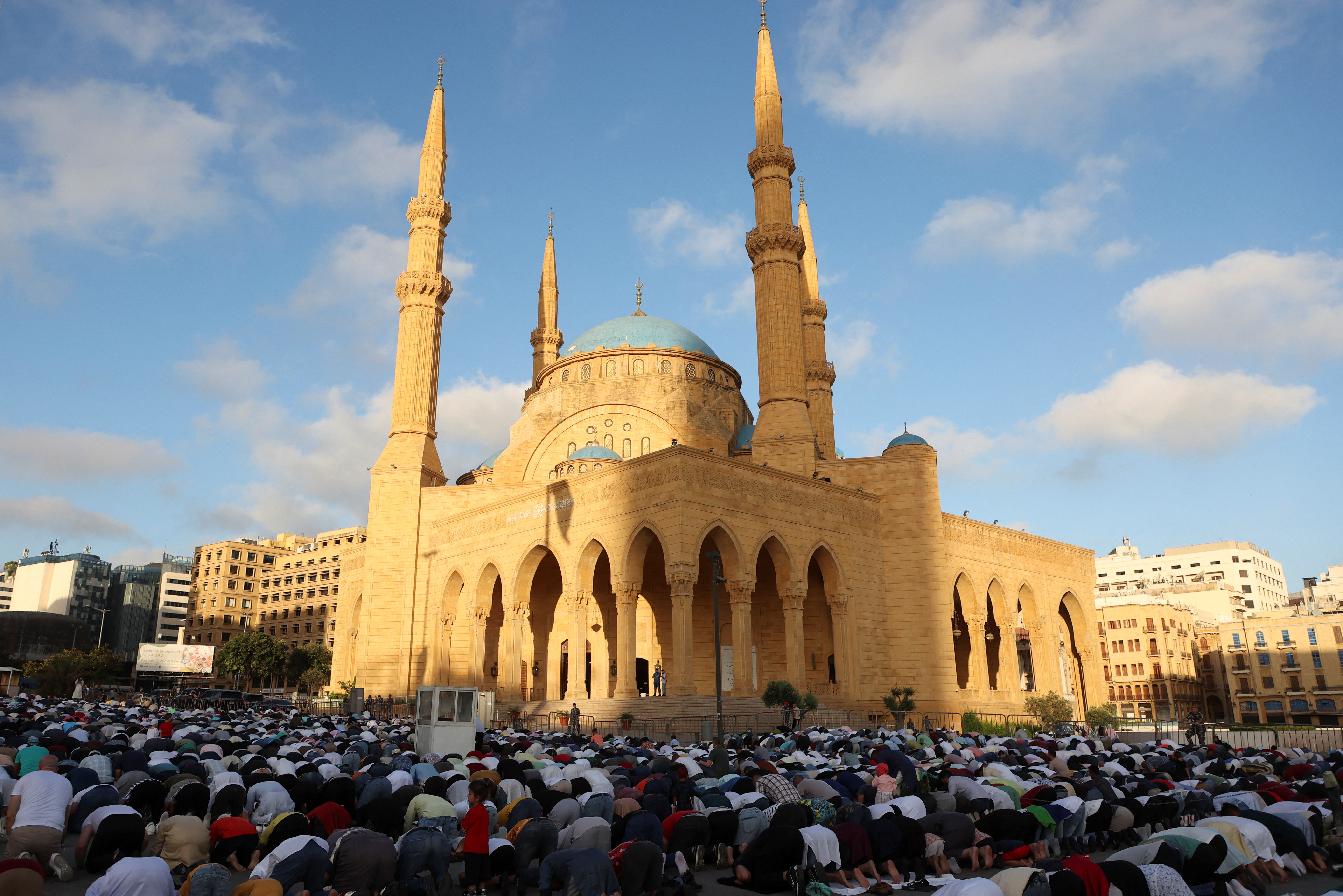Muslim worshippers attend Eid al-Adha prayers outside Al-Amin mosque in downtown Beirut, Lebanon June 16