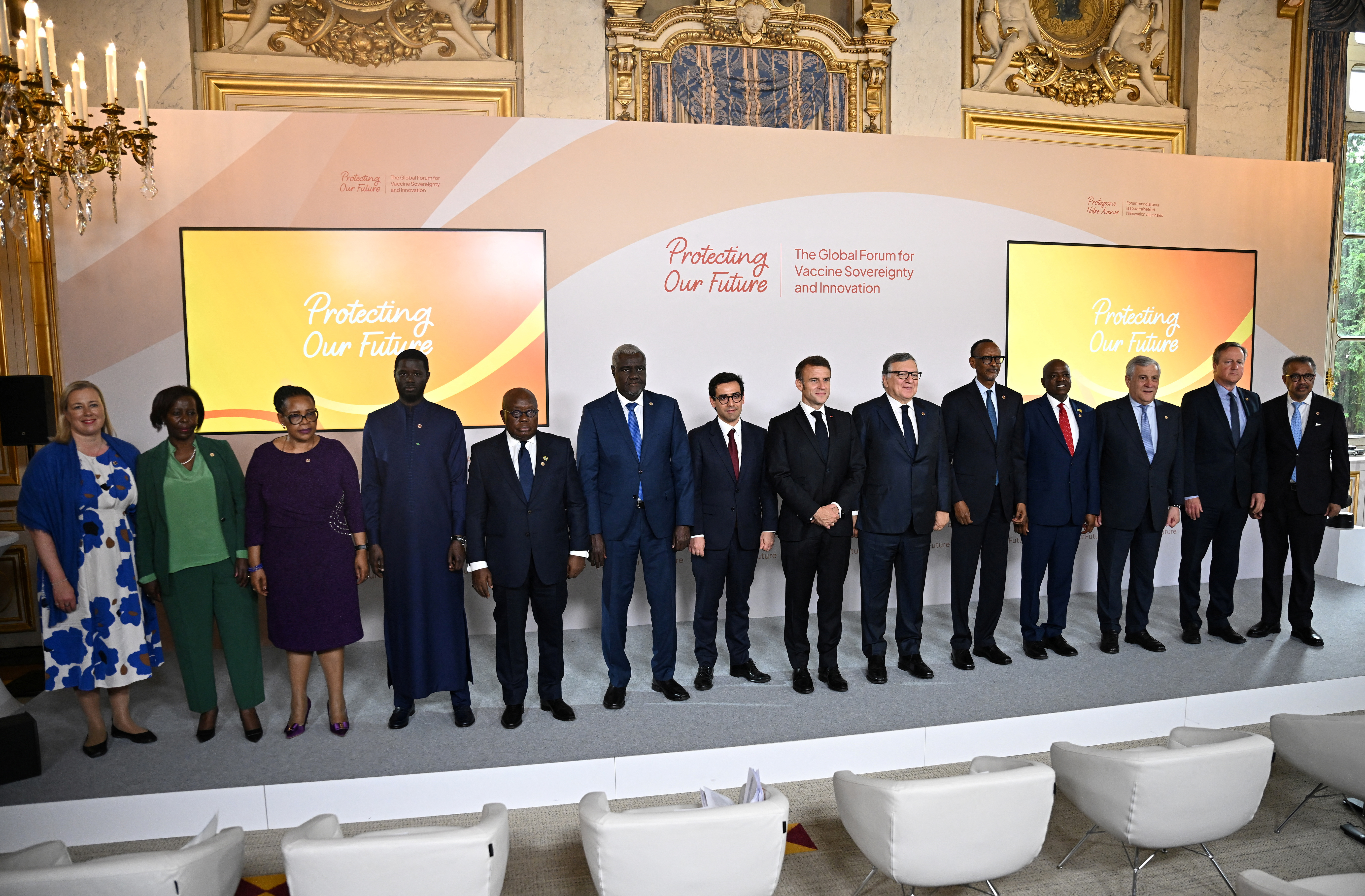 Macron and EU leaders in dark suits on a stage