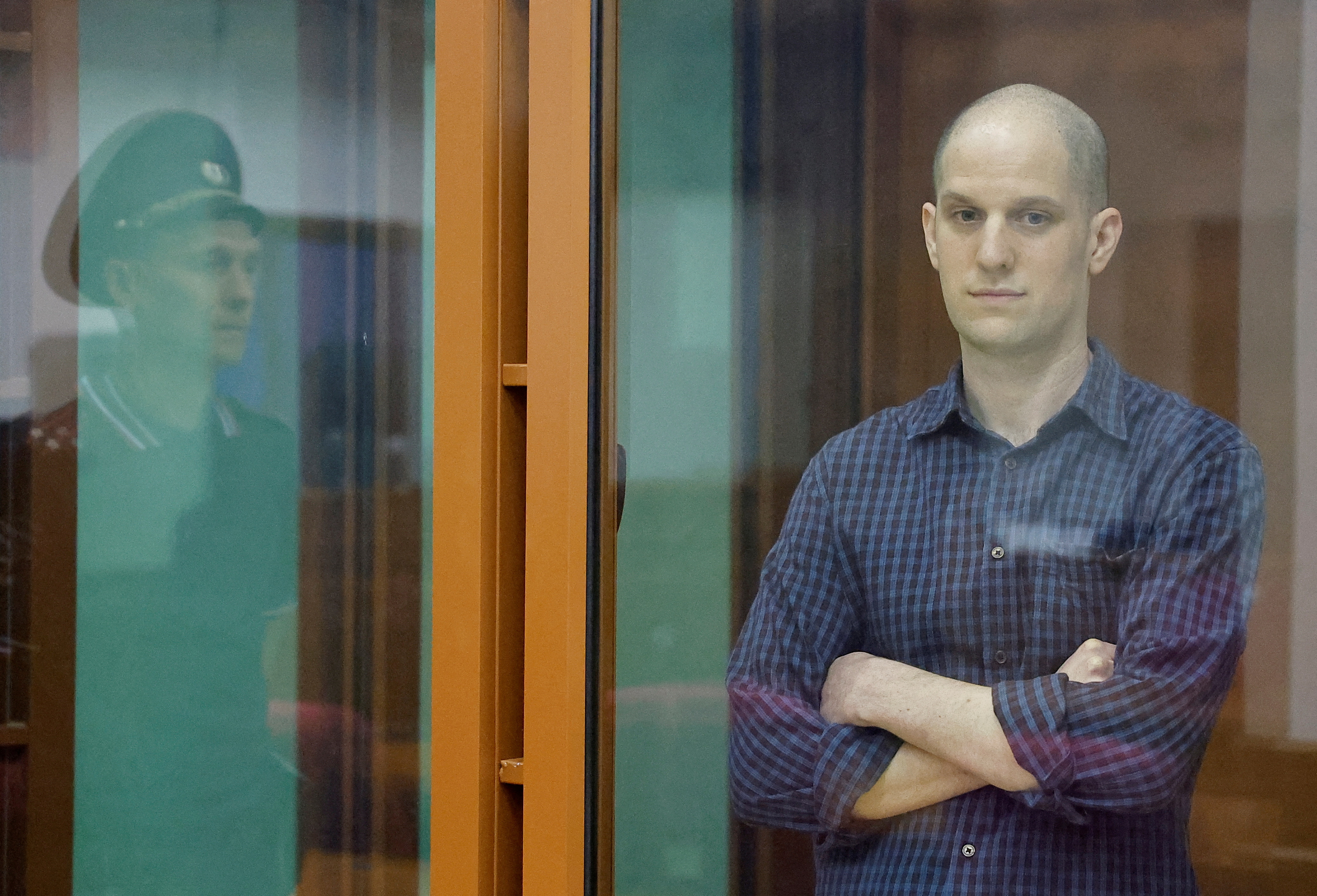 Wall Street Journal reporter Evan Gershkovich, who stands trial on spying charges, is seen inside an enclosure for defendants before a court hearing in Yekaterinburg, Russia June 26