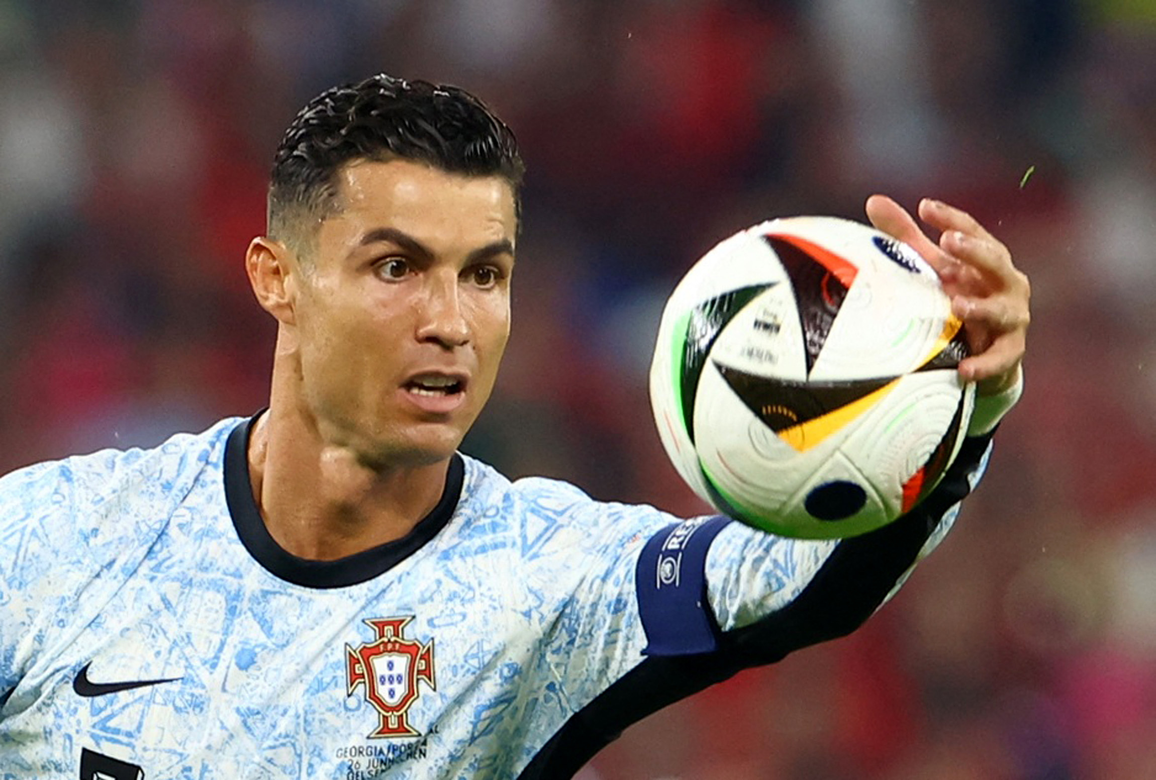 Football player handling ball.