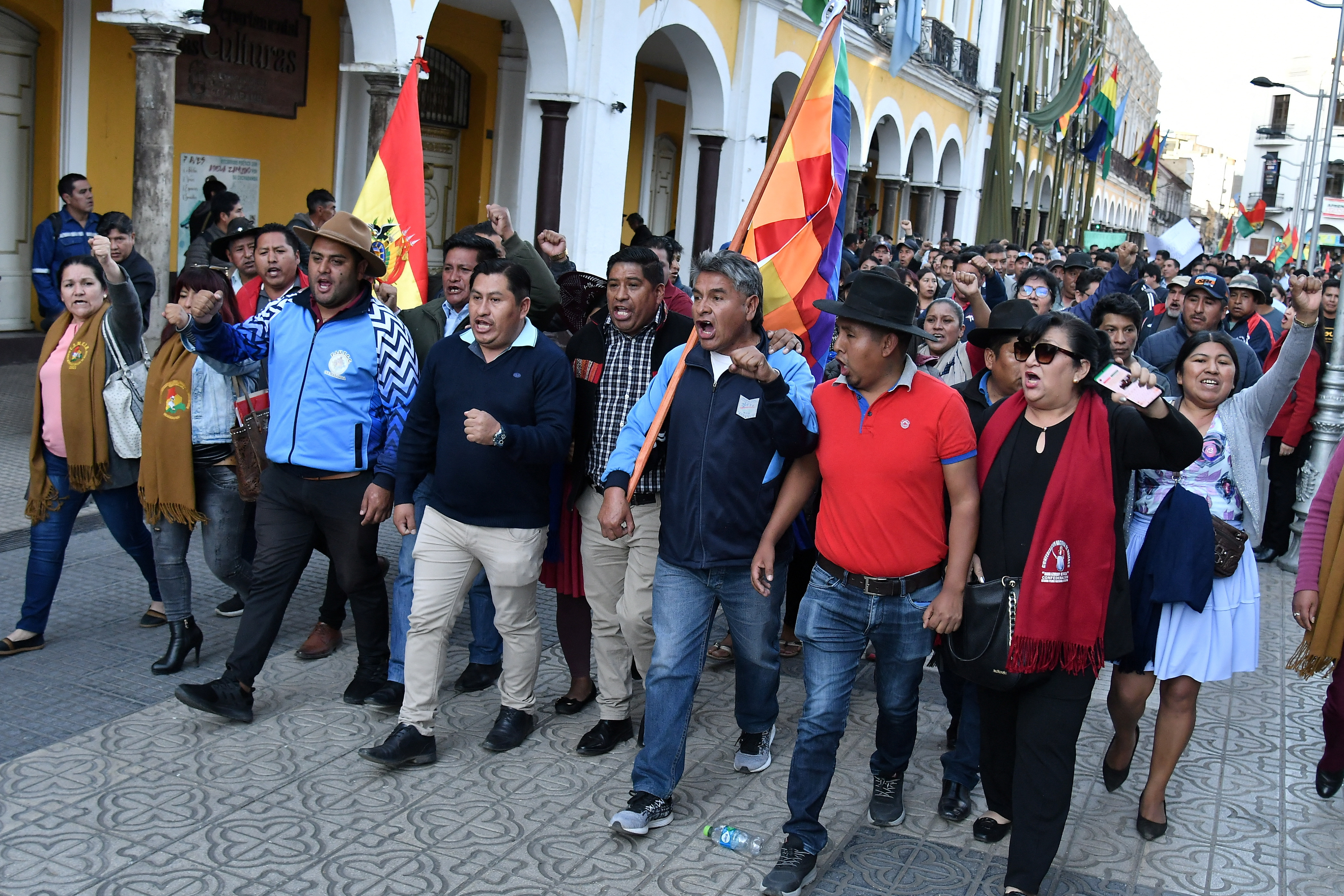 People march through the streets of Bolivia.