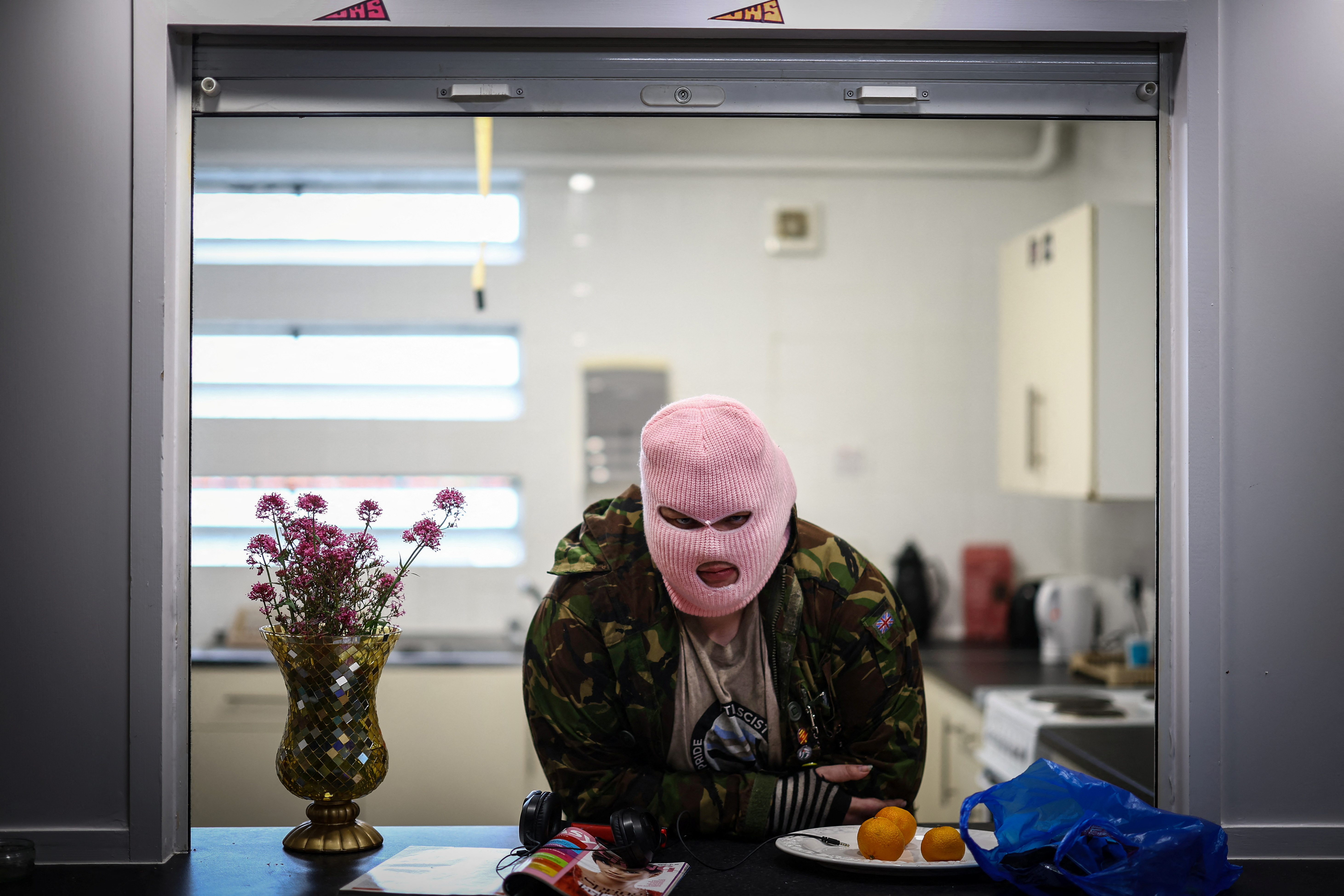 A squatter, who goes by the name of Leaf, 28, relaxes in the place they live, an empty former youth centre that is now occupied by squatter activist group Reclaim Croydon, in Croydon, south London, Britain, June 12