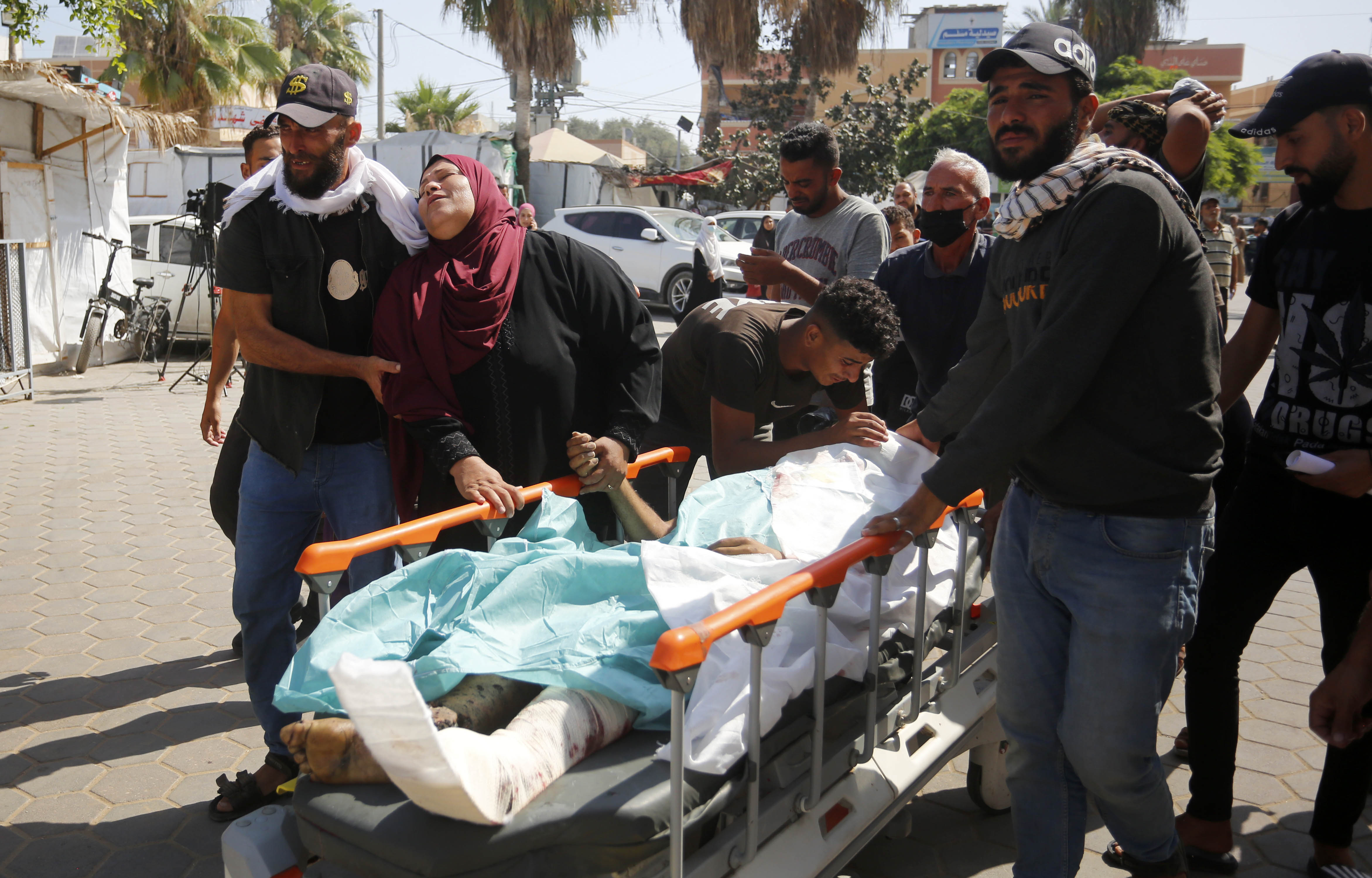The dead and wounded, including children, are brought to al-Aqsa Martyrs Hospital