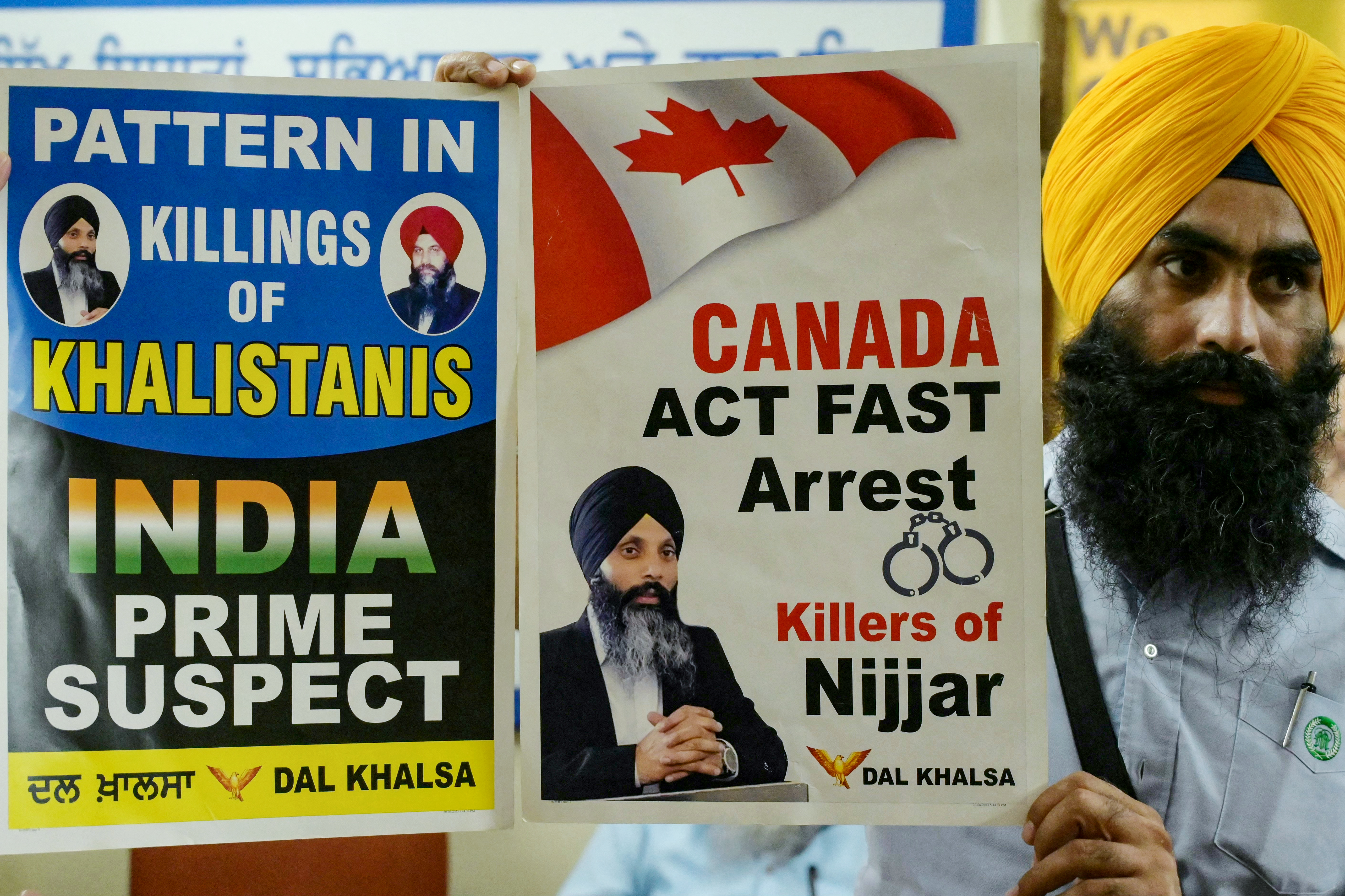 A member of a Sikh organisation holds a placard displaying Sikh separatist Hardeep Singh Nijjar in Amritsar on September 22, 2023. An activist for the creation of an independent Sikh homeland called Khalistan, Hardeep Singh Nijjar was wanted by Indian authorities for alleged terrorism and conspiracy to commit murder, and was shot dead by two masked assailants near Vancouver in June.