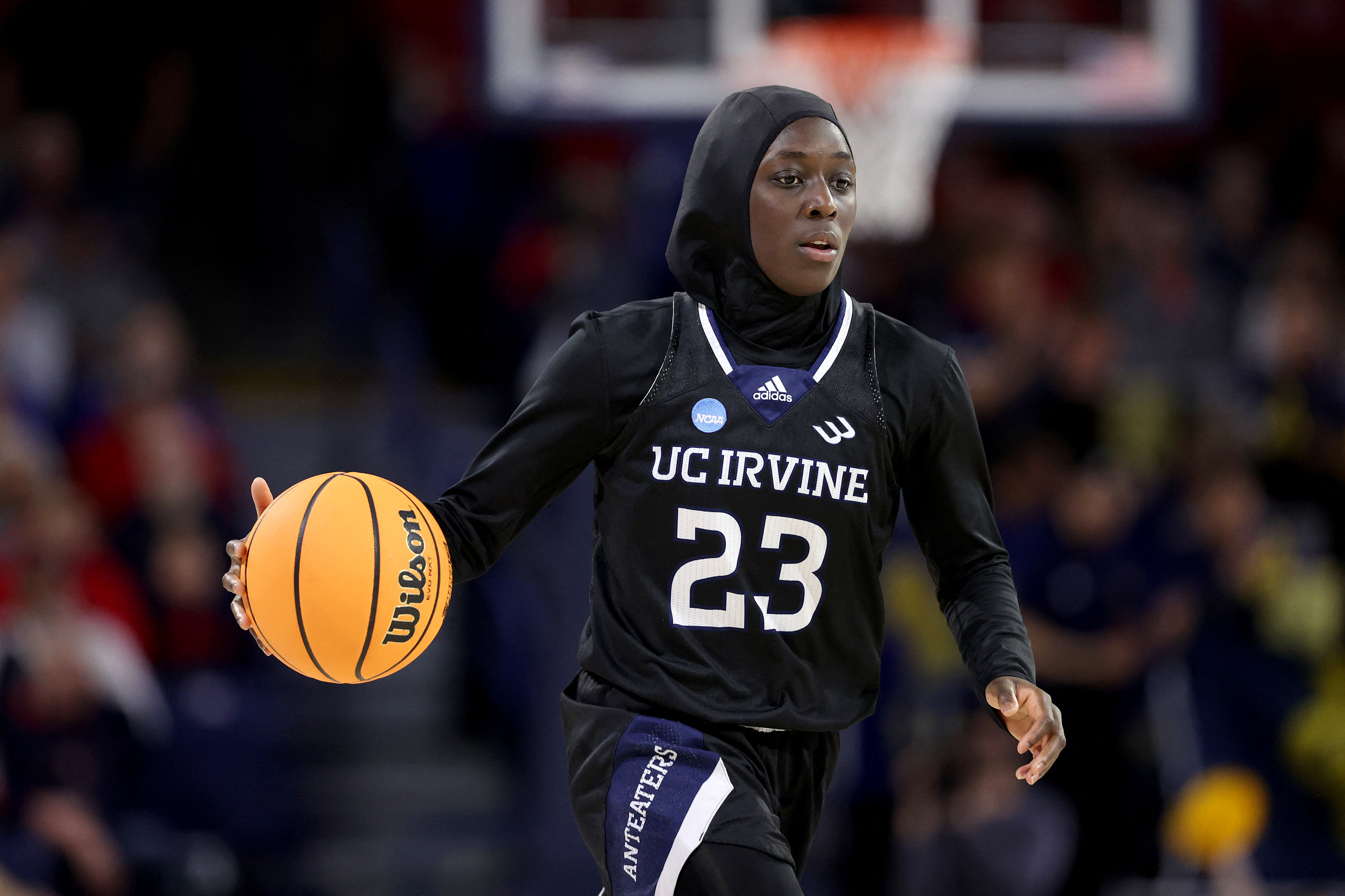 Basketball player wearing a hijab.