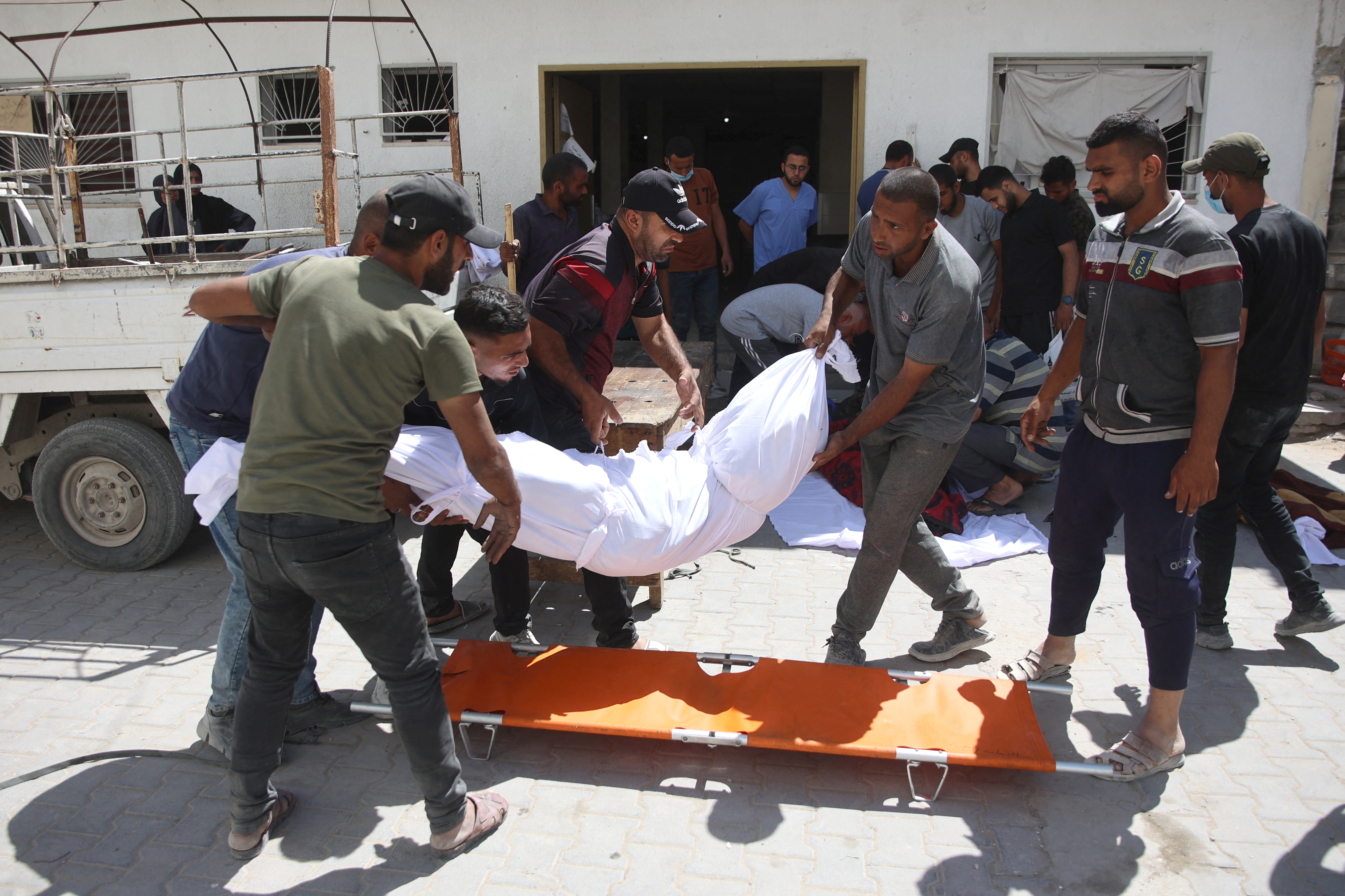 Palestinians carry the body of a Gazan killed in an Israeli strike in the Jabalia refugee camp in the northern Gaza on June 1