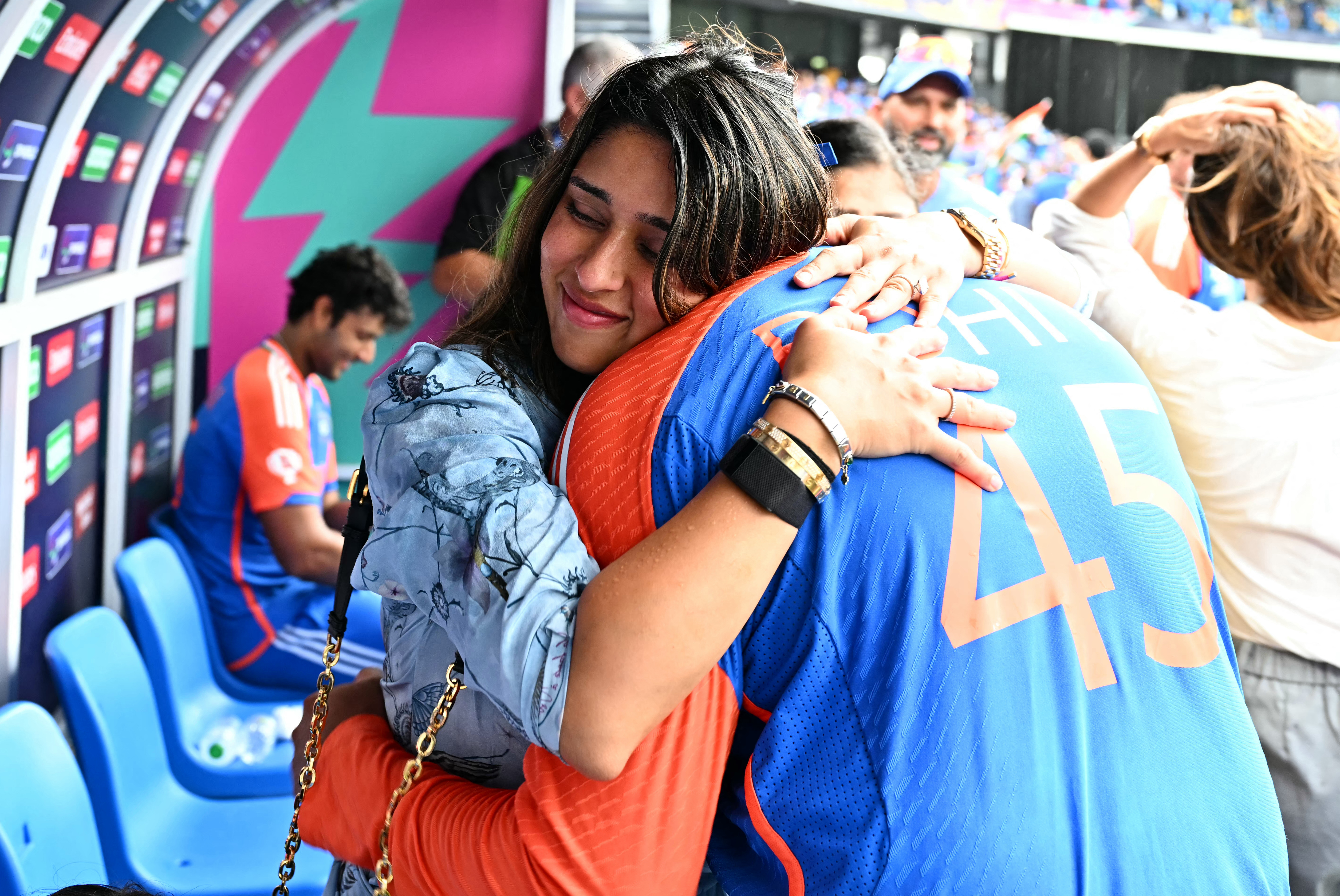 India's captain Rohit Sharma hugs his wife Ritika Sajdeh after India won the ICC men's Twenty20 World Cup 2024 final cricket match between India and South Africa at Kensington Oval in Bridgetown, Barbados, on June 29, 2024. (Photo by CHANDAN KHANNA / AFP)