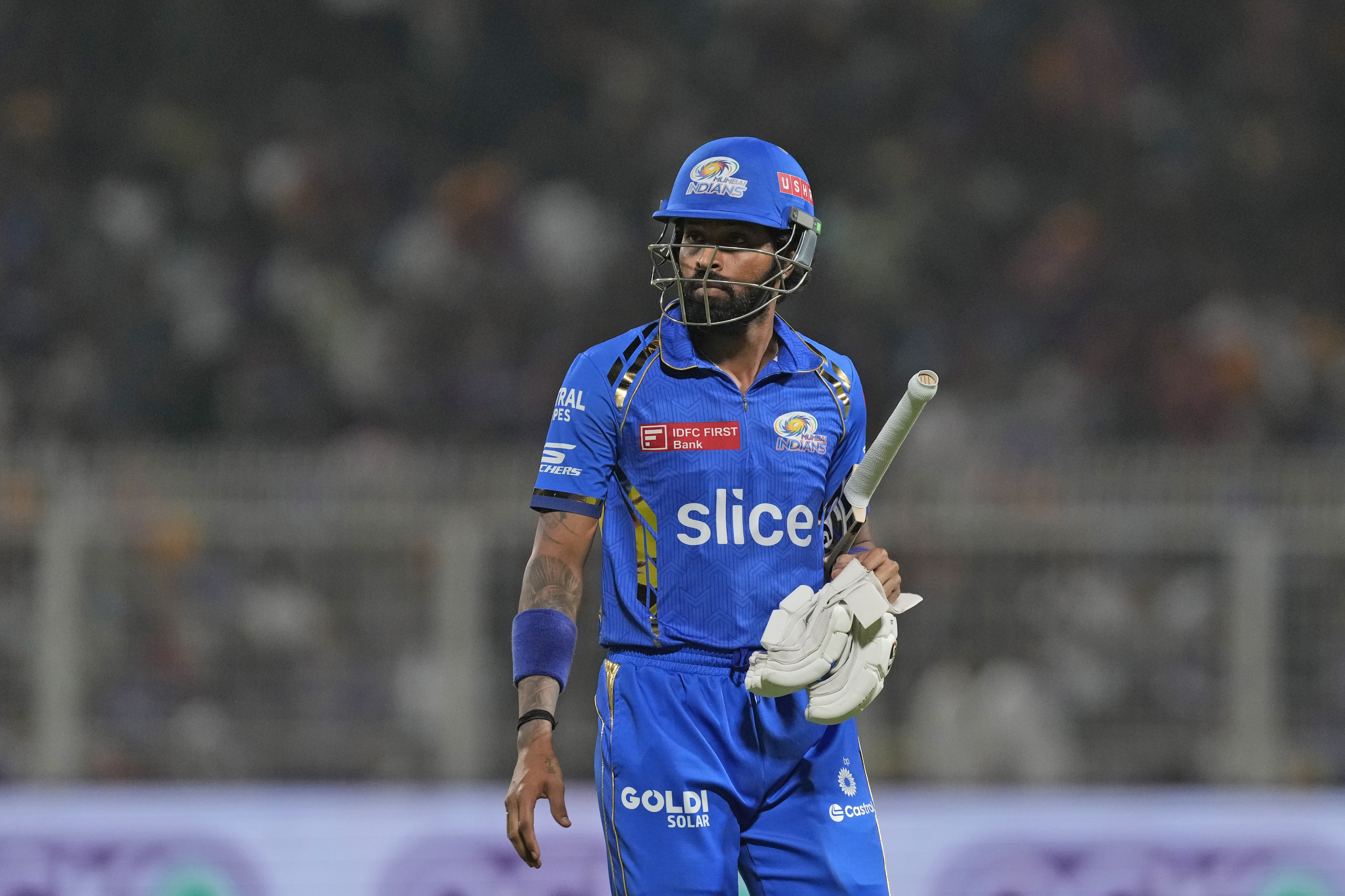 Mumbai Indians' captain Hardik Pandya walks off the field after losing his wicket during the Indian Premier League cricket match between Kolkata Knight Riders and Mumbai Indians in Kolkata, India, Saturday, May. 11, 2023. (AP Photo/Bikas Das)