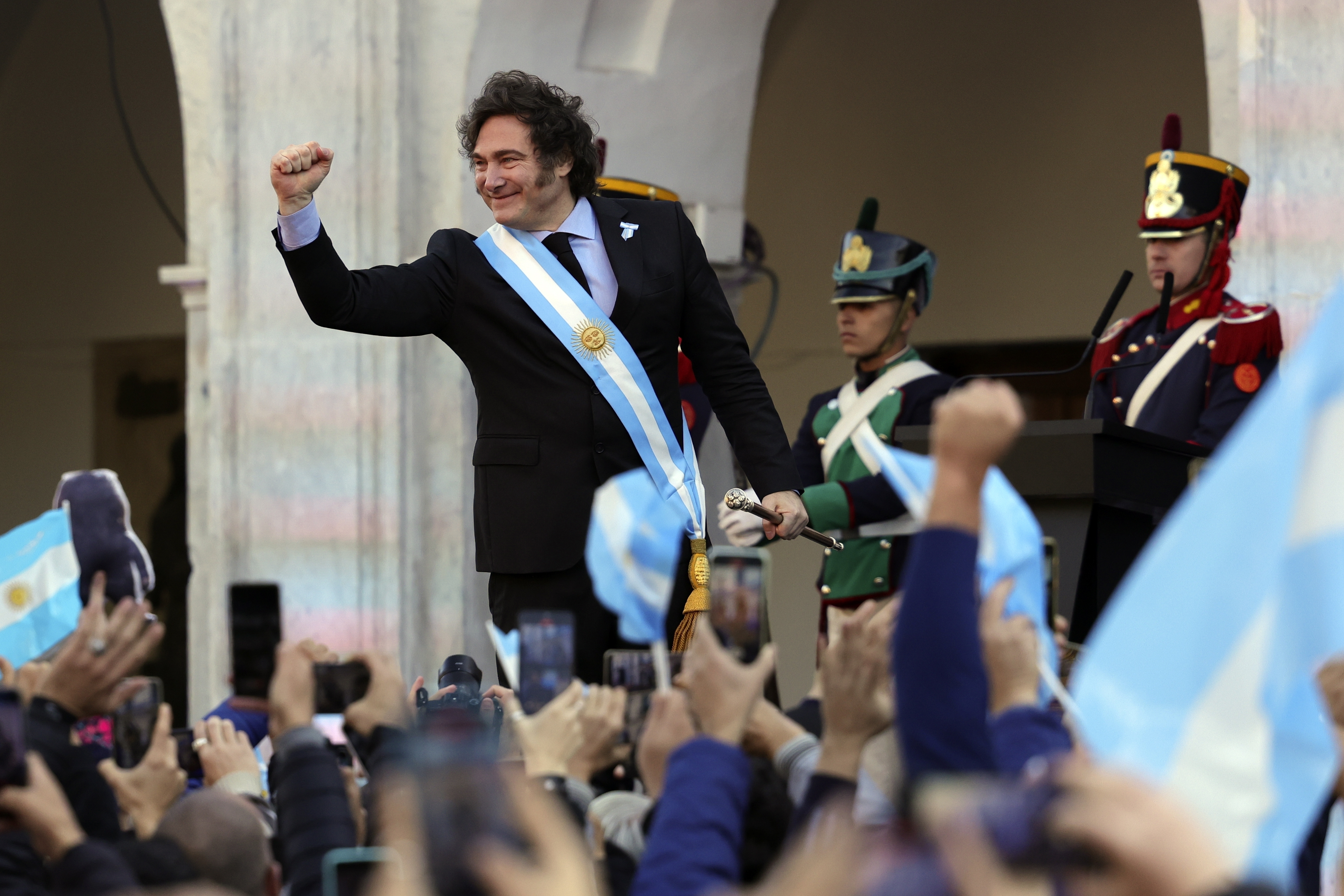 Argentine President Javier Milei holds out his fist during a ceremony celebrating the 214th anniversary of the May Revolution, which marked the beginning of the country's independence from Spain, in Cordoba, Argentina, May 25