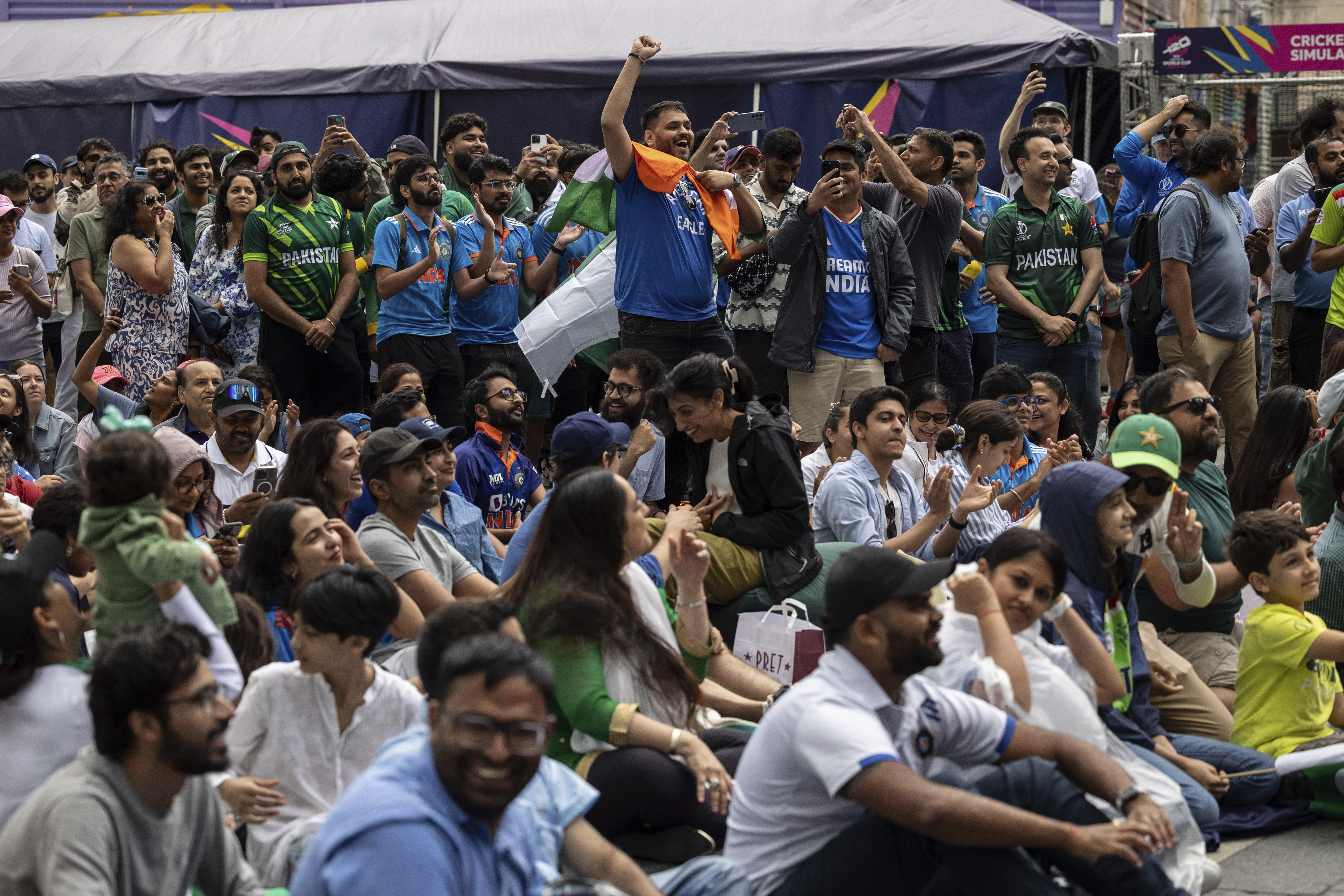 A fan waves Pakistan flag at the viewing party for the ICC Men's T20 World Cup cricket match between India and Pakistan at The Oculus on Sunday, June 9, 2024, in New York. (AP Photo/Yuki Iwamura)