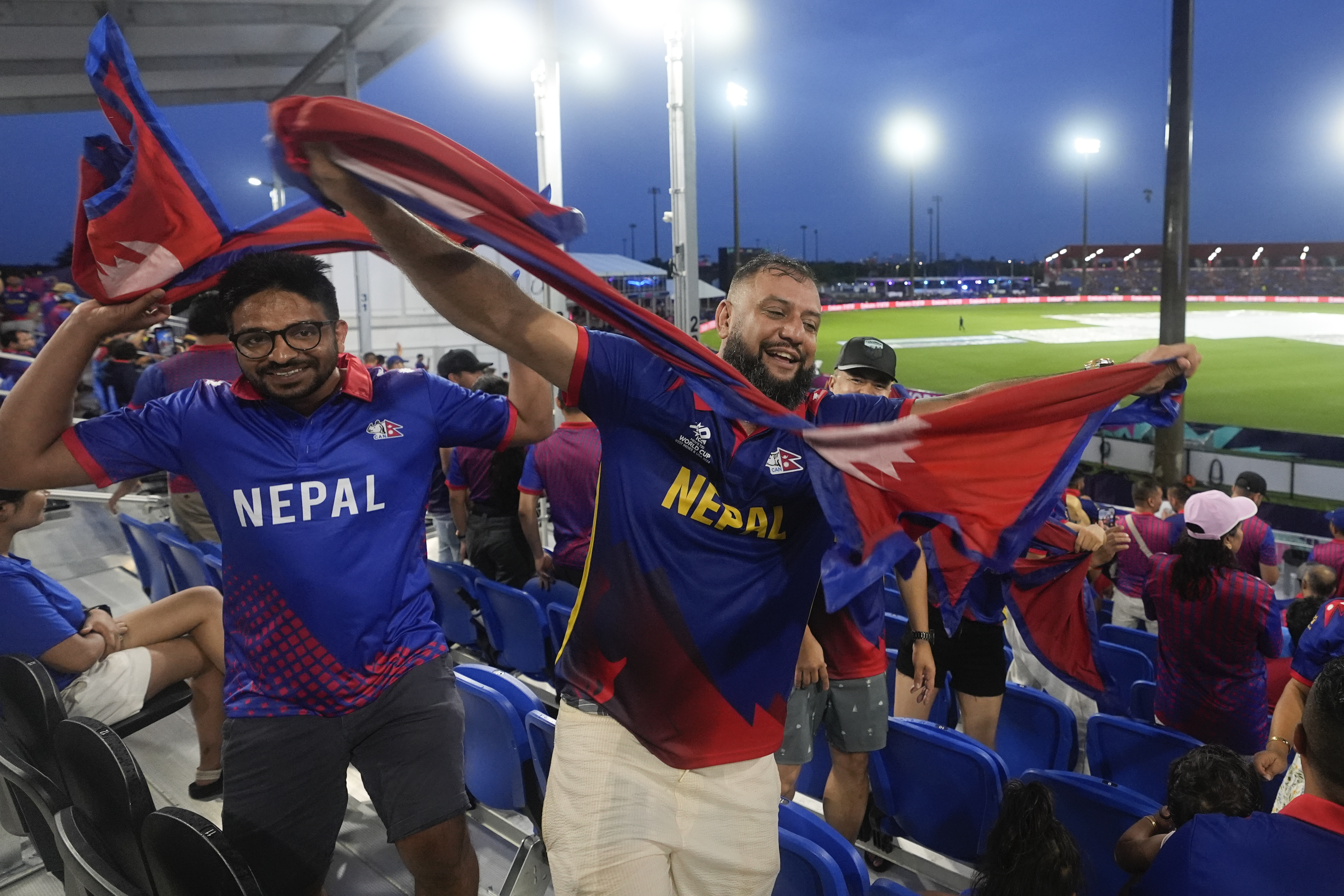 Nepal supporters cheer for their team.