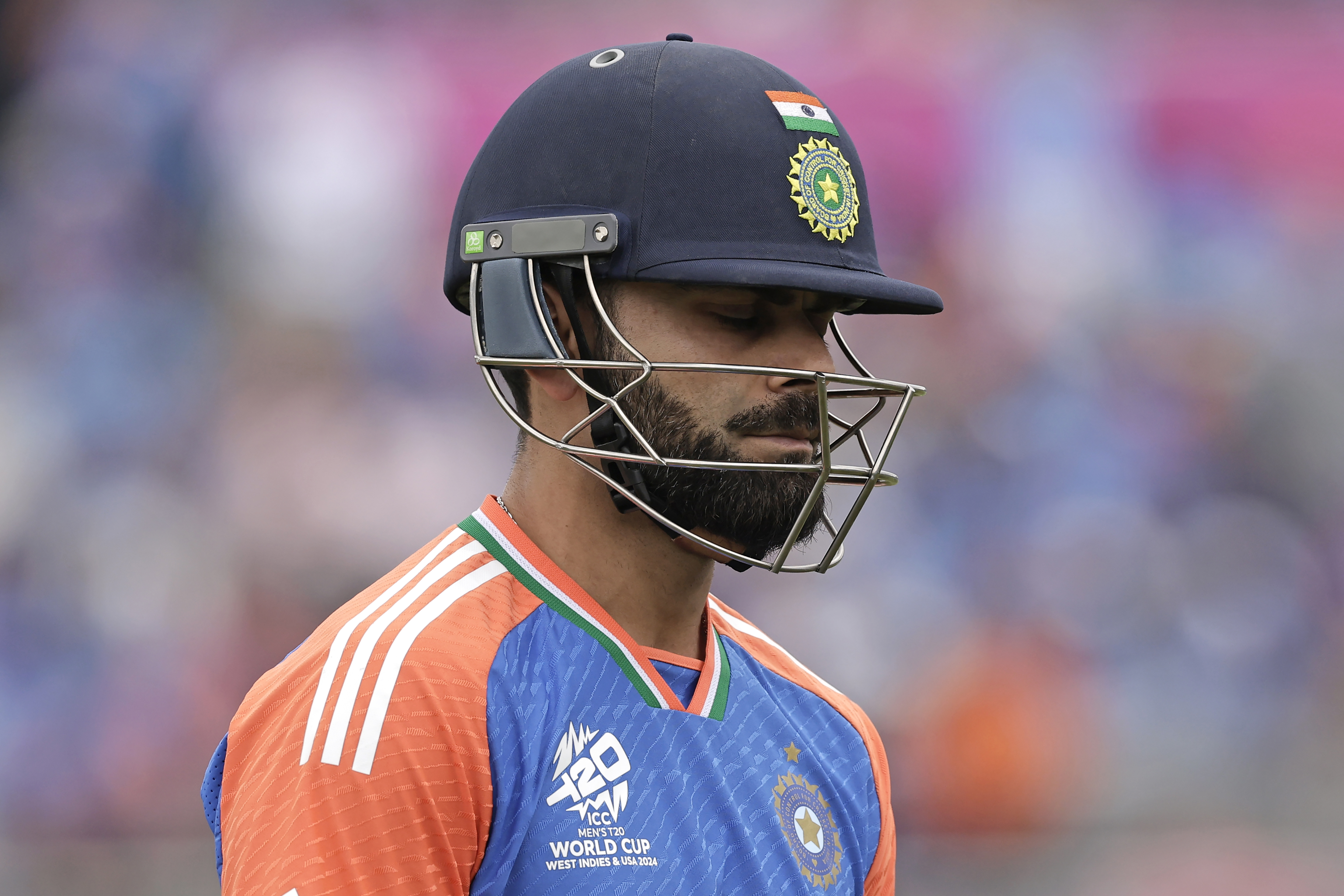 India's Virat Kohli reacts as he walks off the field after losing his wicket during the ICC Men's T20 World Cup cricket match between United States and India at the Nassau County International Cricket Stadium in Westbury, New York, Wednesday, June 12, 2024. (AP Photo/Adam Hunger)