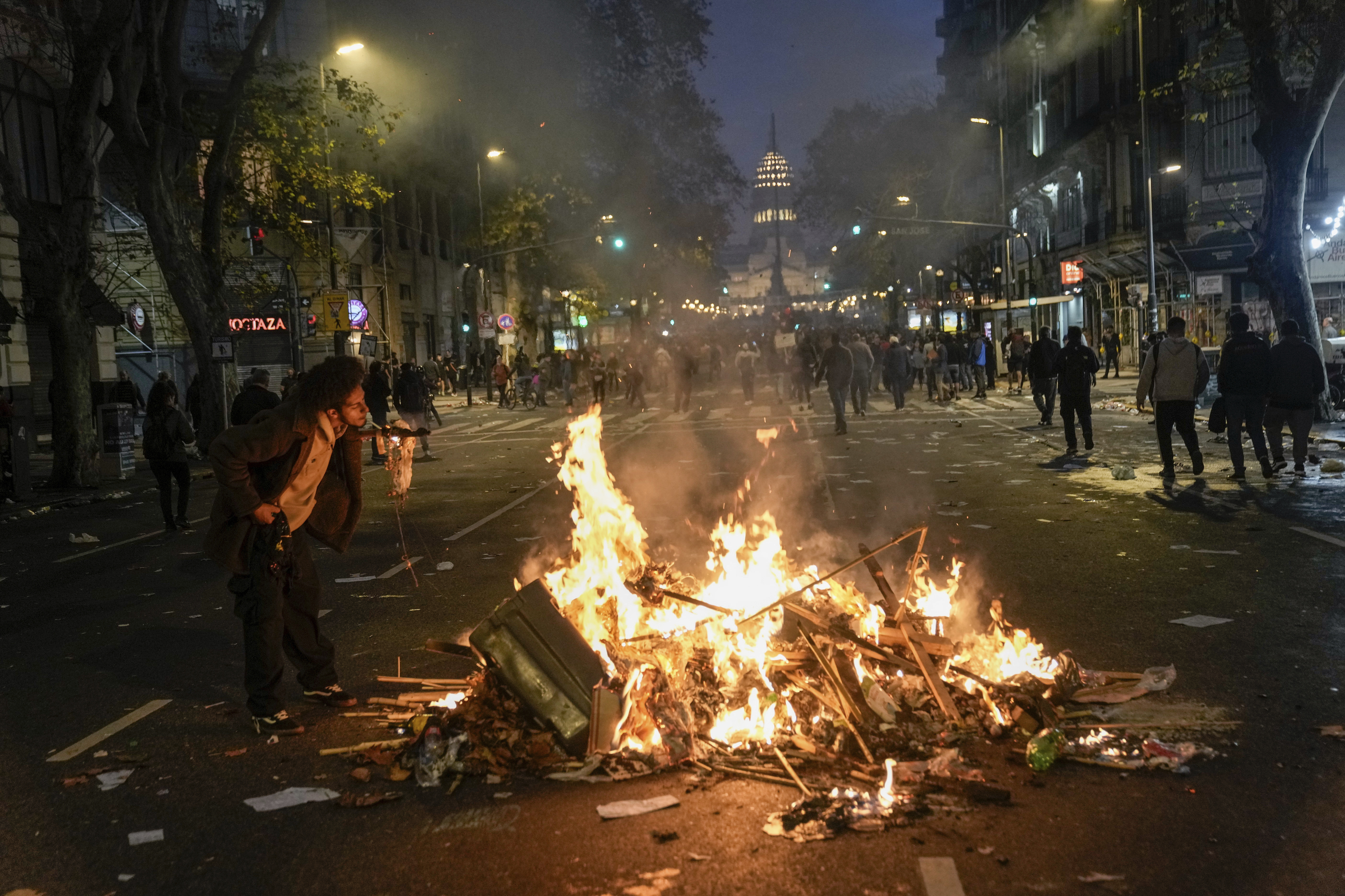 Trash burns in the street leading to Argentina's Congress.