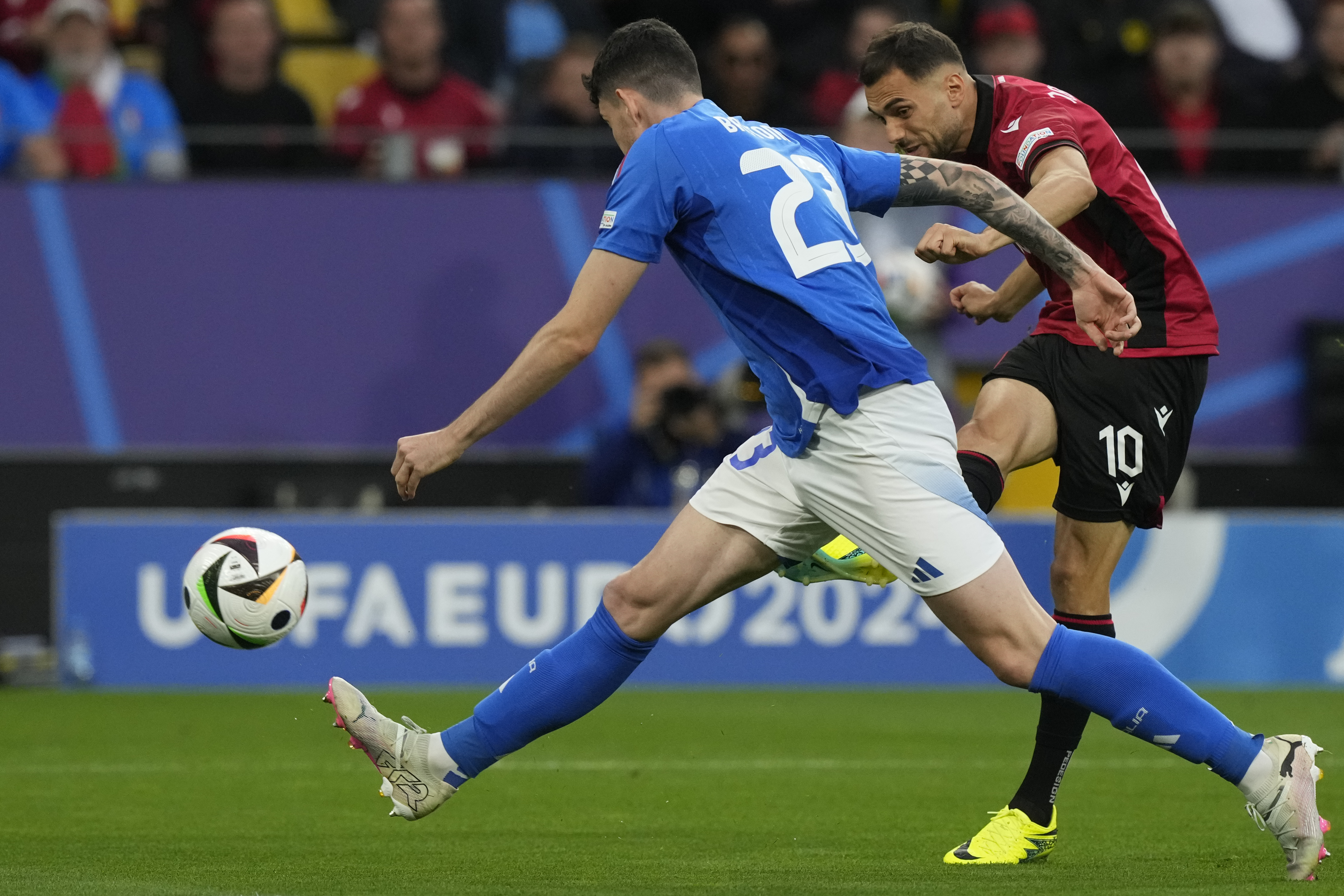 Football players kicks goal.