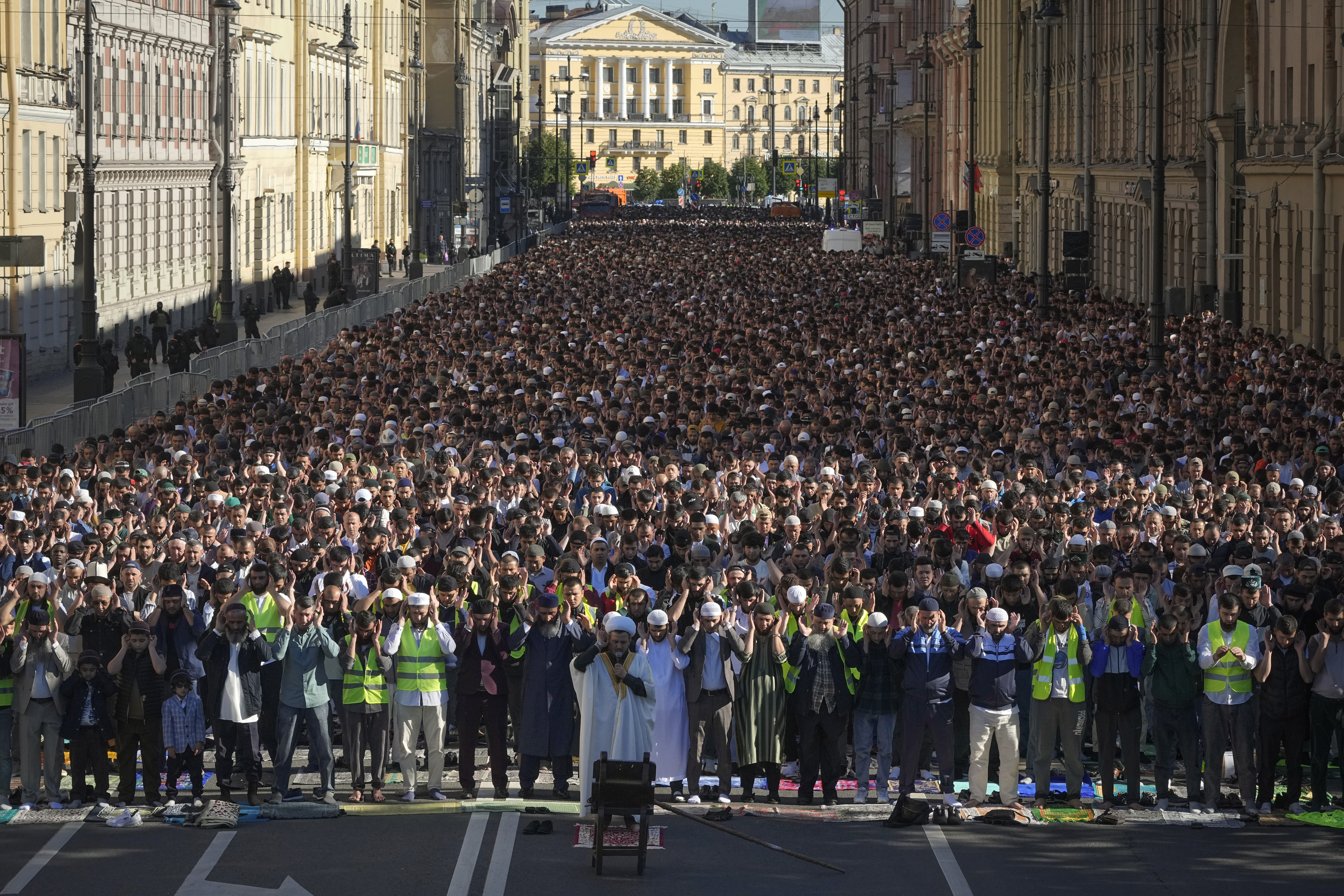 Muslims offer Eid al-Adha prayers at the Moskovsky central avenue during celebrations in St. Petersburg, Russia