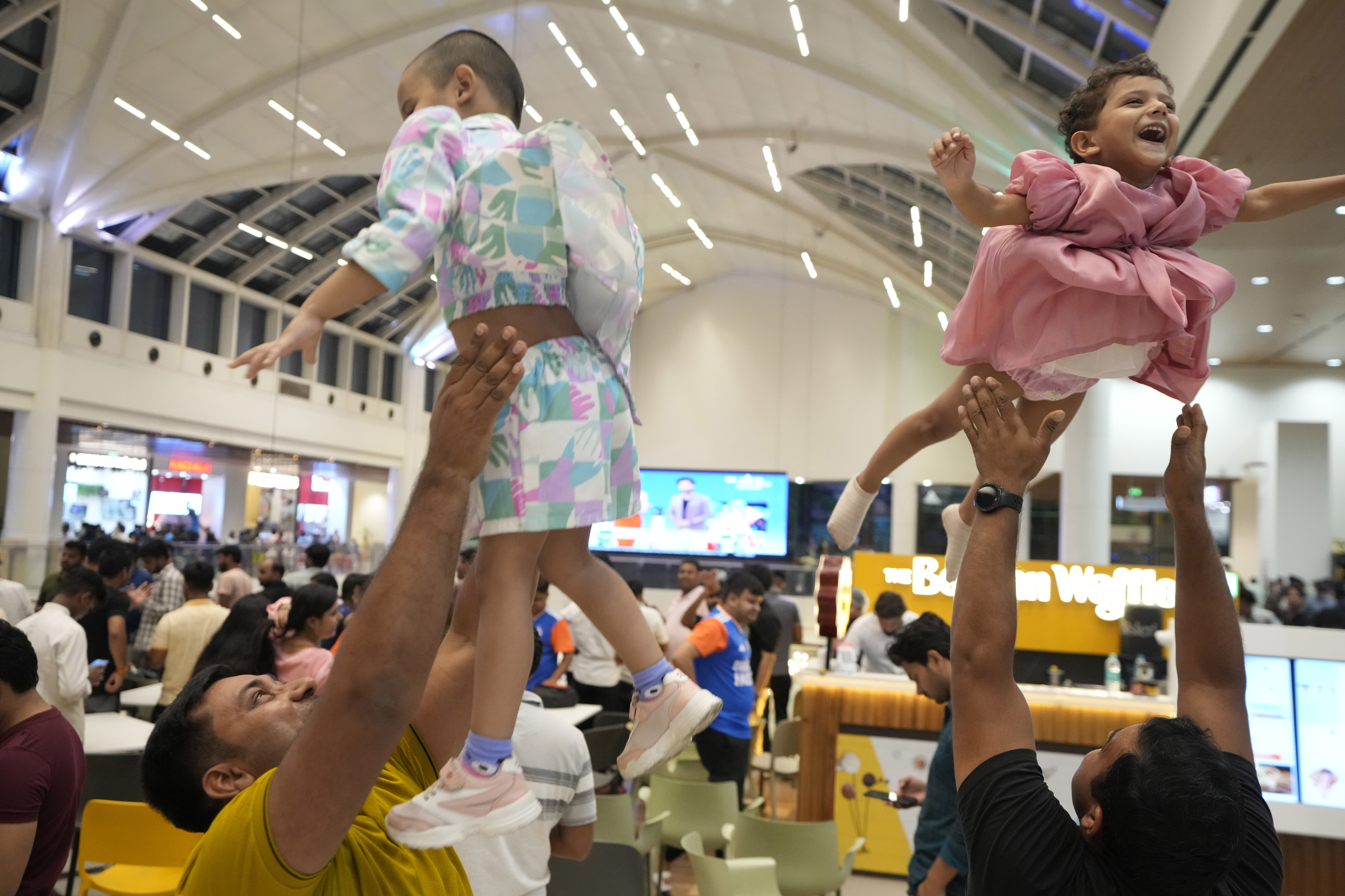 Cricket fans celebrate after India wins the ICC Men's T20 World Cup final match against South Africa played at Barbados, in a shopping mall in Lucknow, India, Saturday June 29