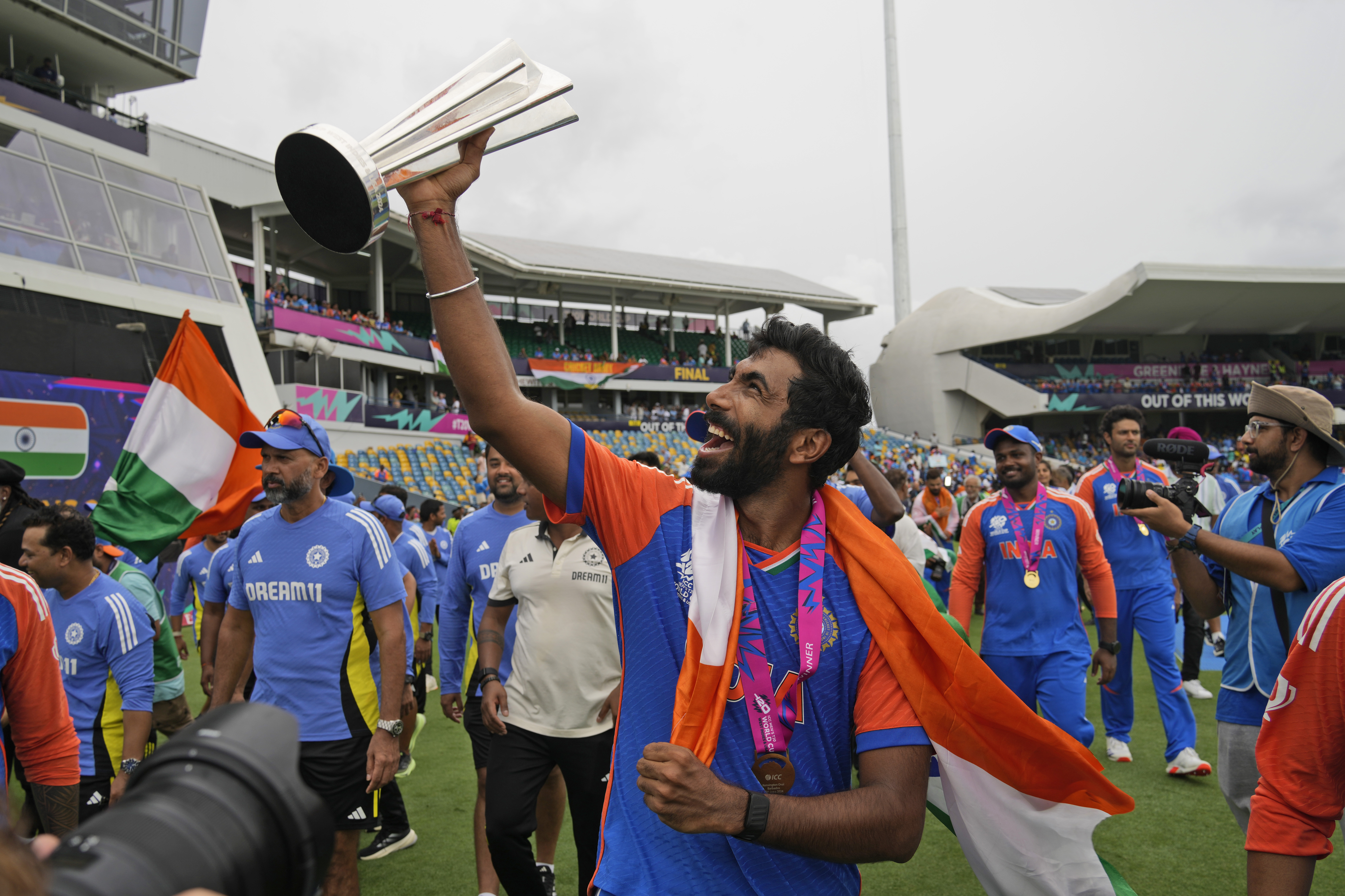 India's Jasprit Bumrah celebrates with the winners' trophy after India won the ICC Men's T20 World Cup final cricket match against South Africa at Kensington Oval in Bridgetown, Barbados, Saturday, June 29