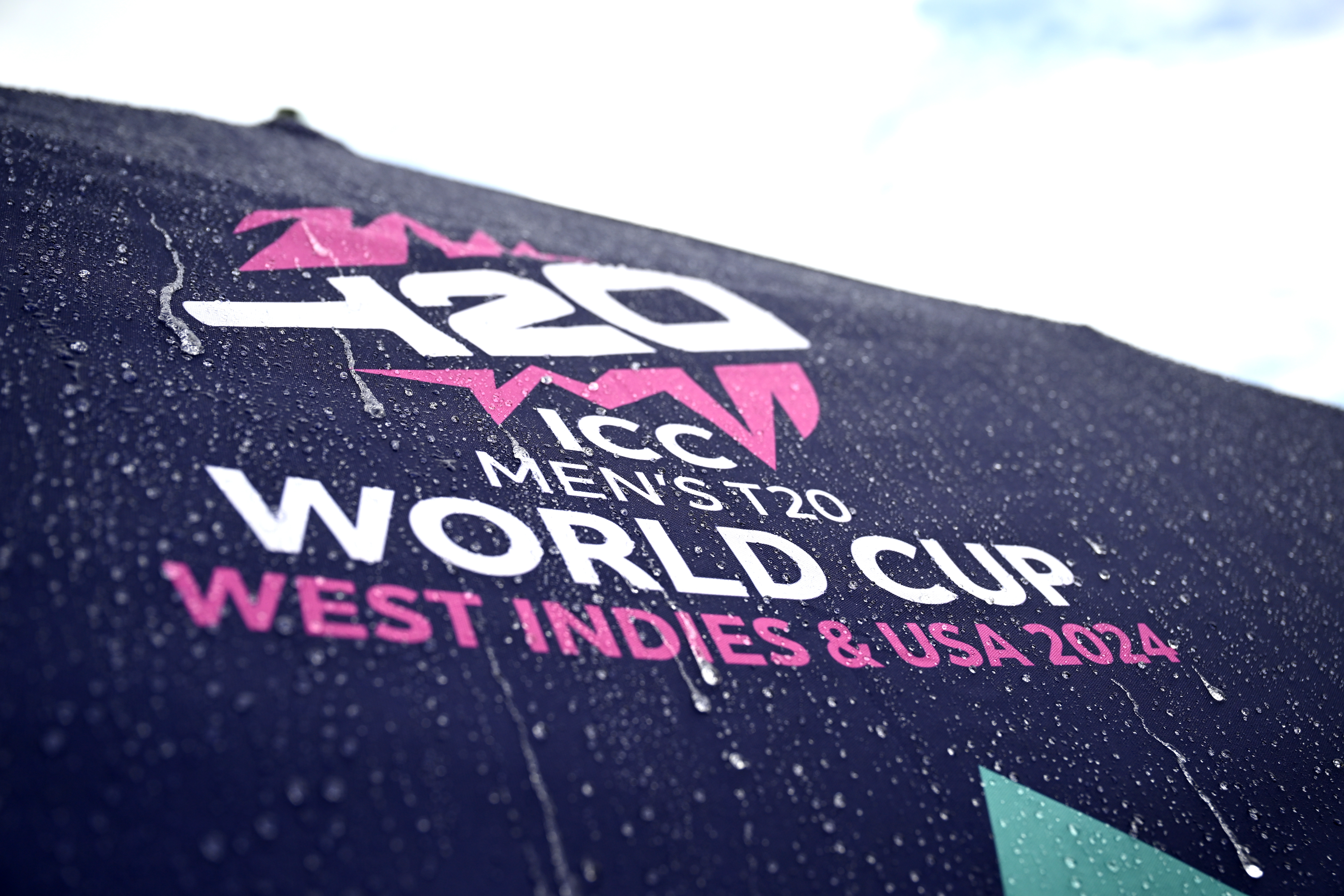 GEORGETOWN, GUYANA - JUNE 27: Rain falls on an umbrella prior to the ICC Men's T20 Cricket World Cup West Indies & USA 2024 Semi-Final match between India and England at Providence Stadium on June 27, 2024 in Georgetown, Guyana. (Photo by Gareth Copley/Getty Images)