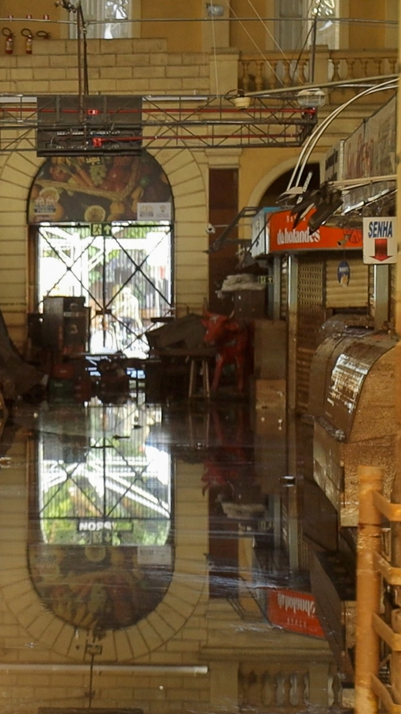 Moody water fills the halls and stalls of Porto Alegre's public market.