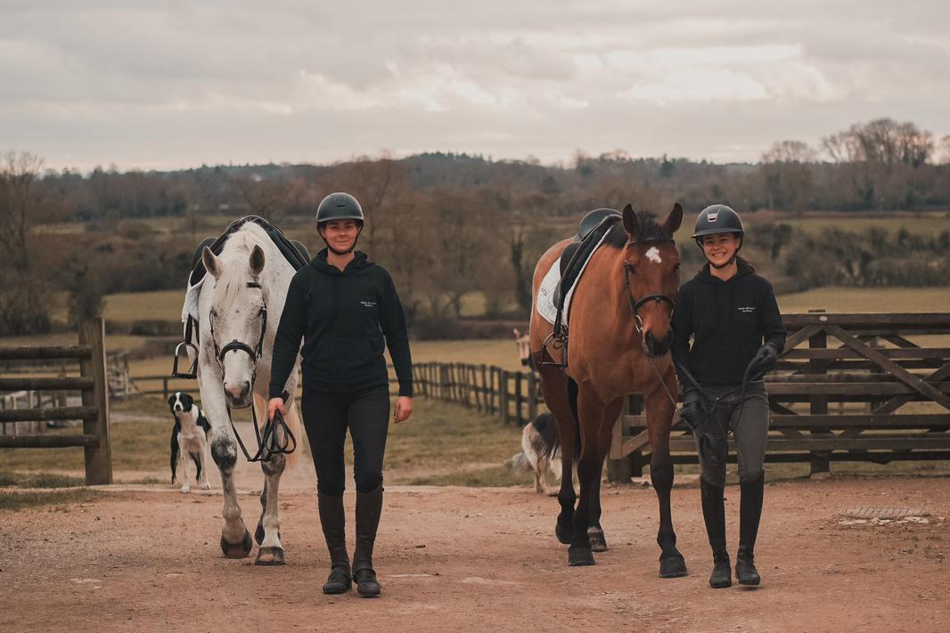 Rider and trainer with their horses.