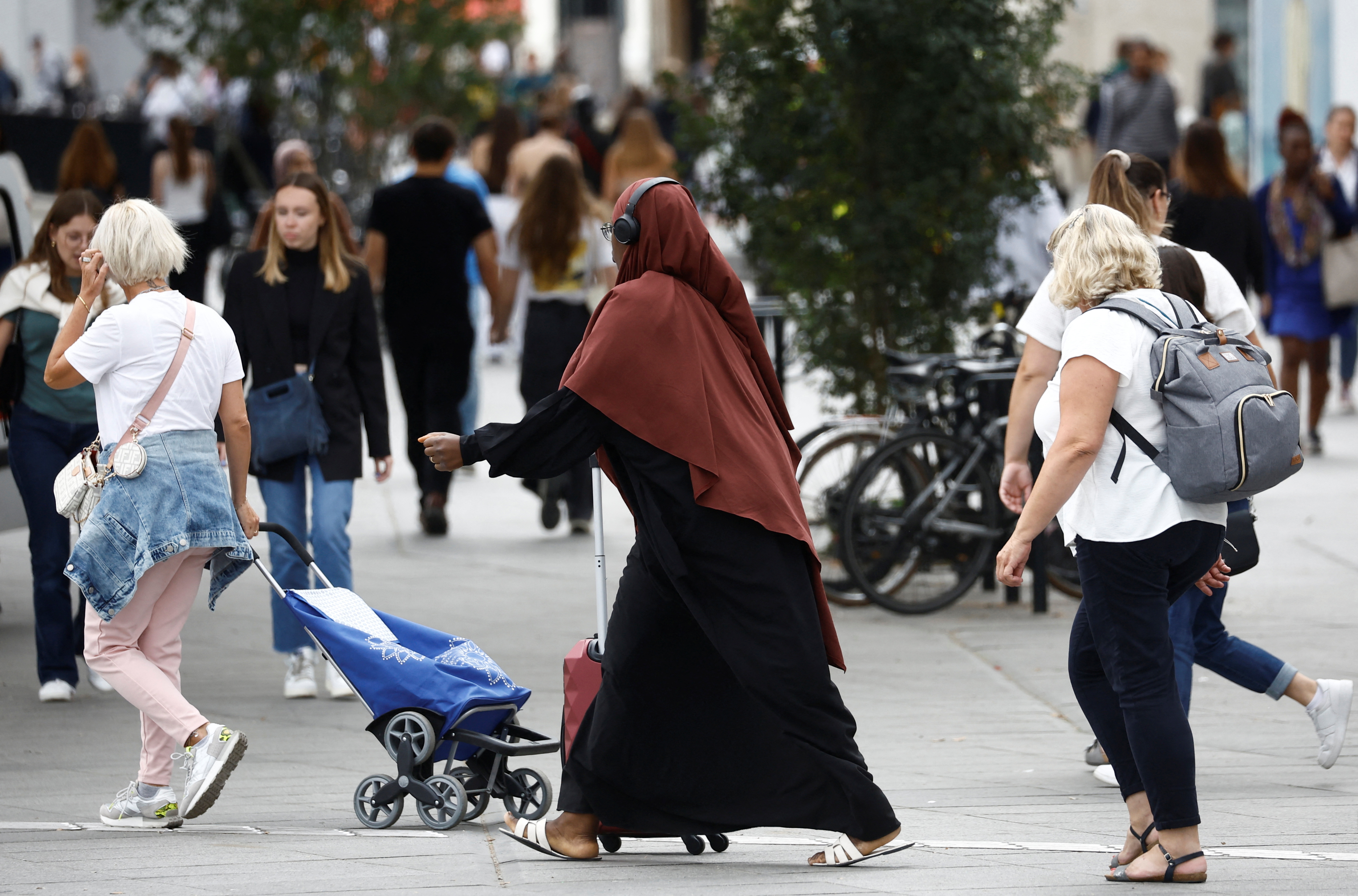 A Muslim woman walks in a street in Nantes, France