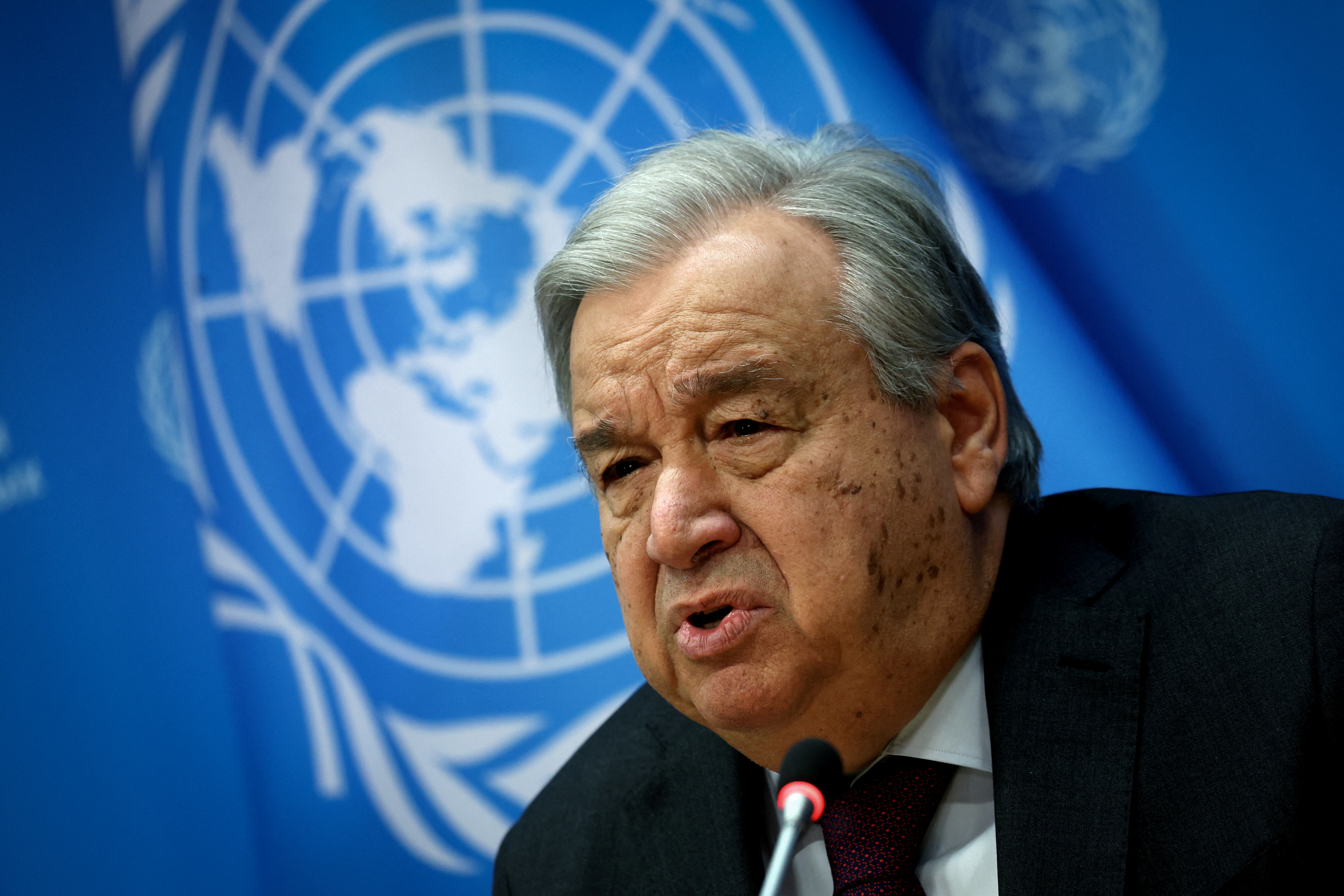 UN chief Antonio Guterres speaks at a microphone
