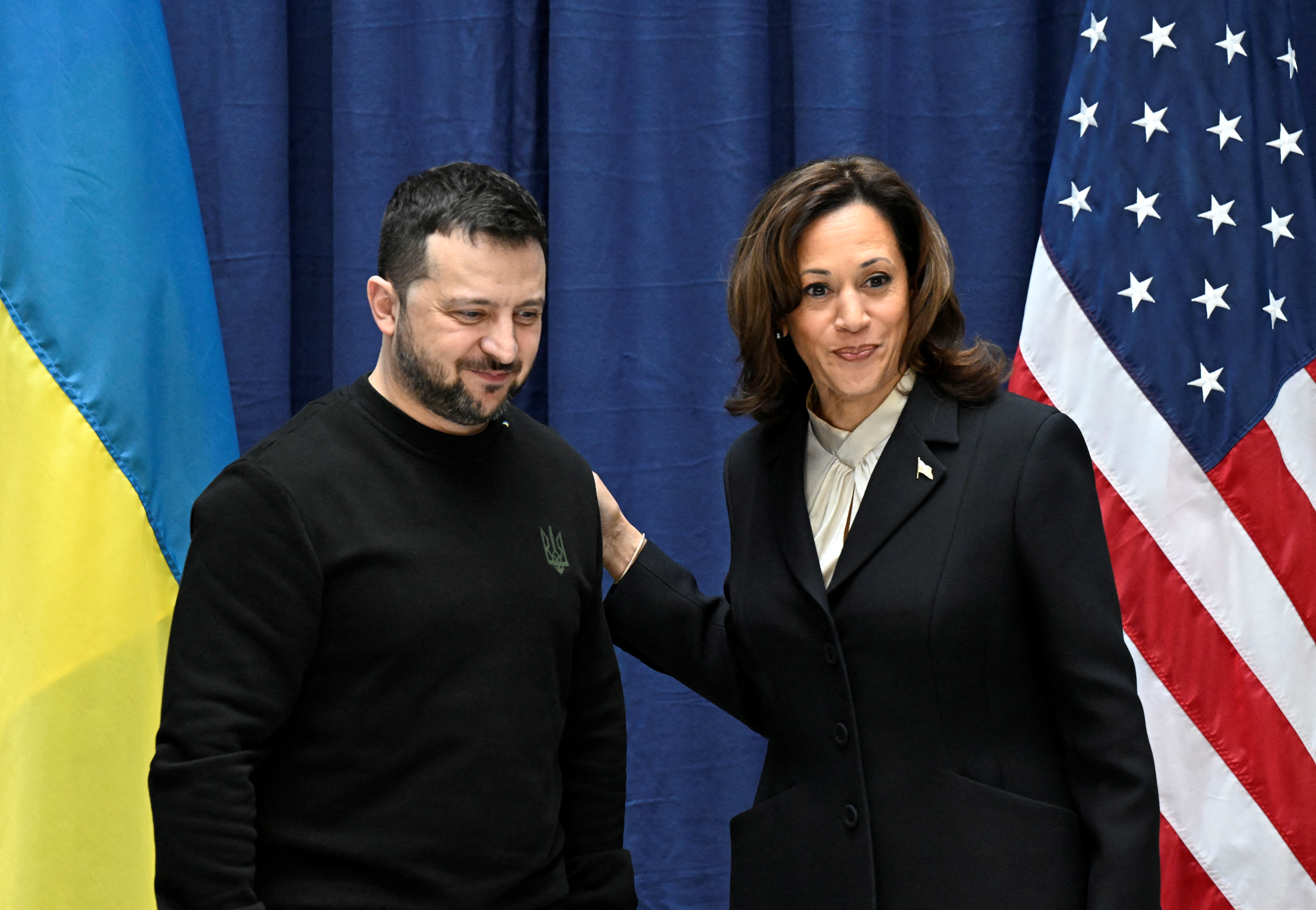 Ukrainian President Volodymyr Zelenskiy and U.S. Vice President Kamala Harris react at the end of a press conference during the Munich Security Conference (MSC) in Munich, southern Germany on February 17, 2024.