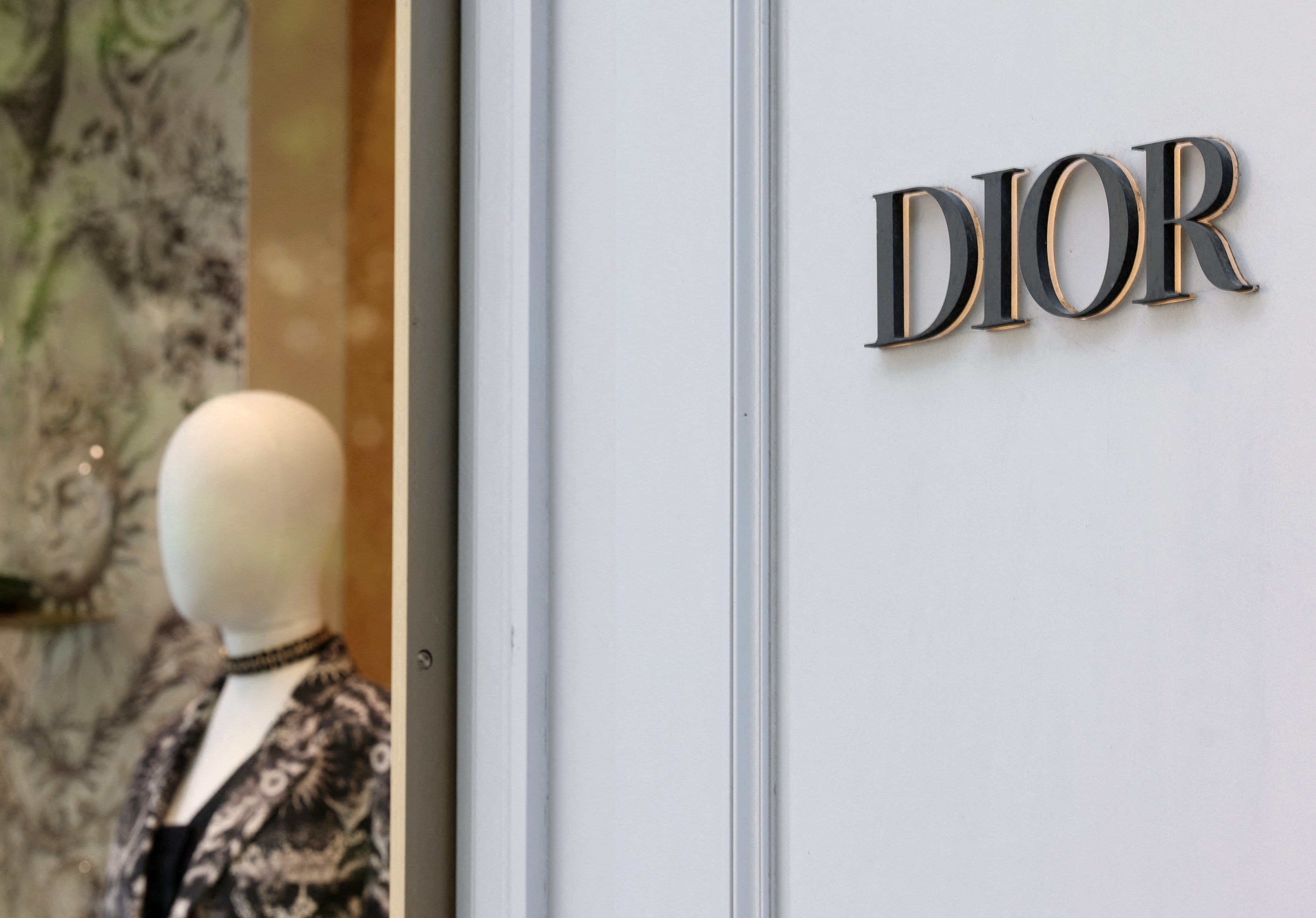 A logo of fashion house Dior is seen outside a shop in Paris