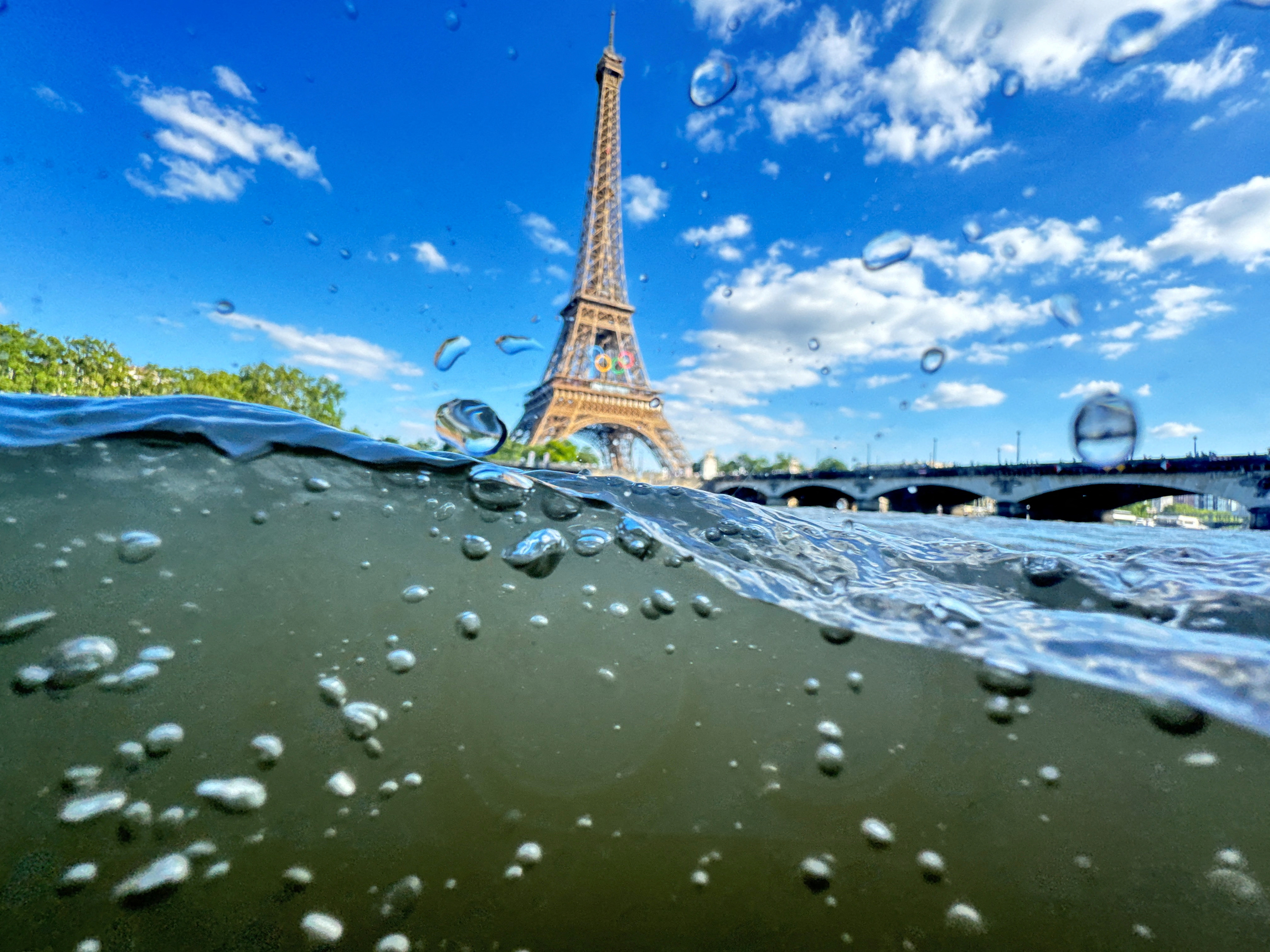 FILE PHOTO: Paris 2024 Olympics - Paris, France - June 23, 2024 The Eiffel Tower is seen from the water of the Seine River as the Olympics opening ceremony rehearsal is postponed amid rainy weather. REUTERS/Pawel Kopczynski/File Photo