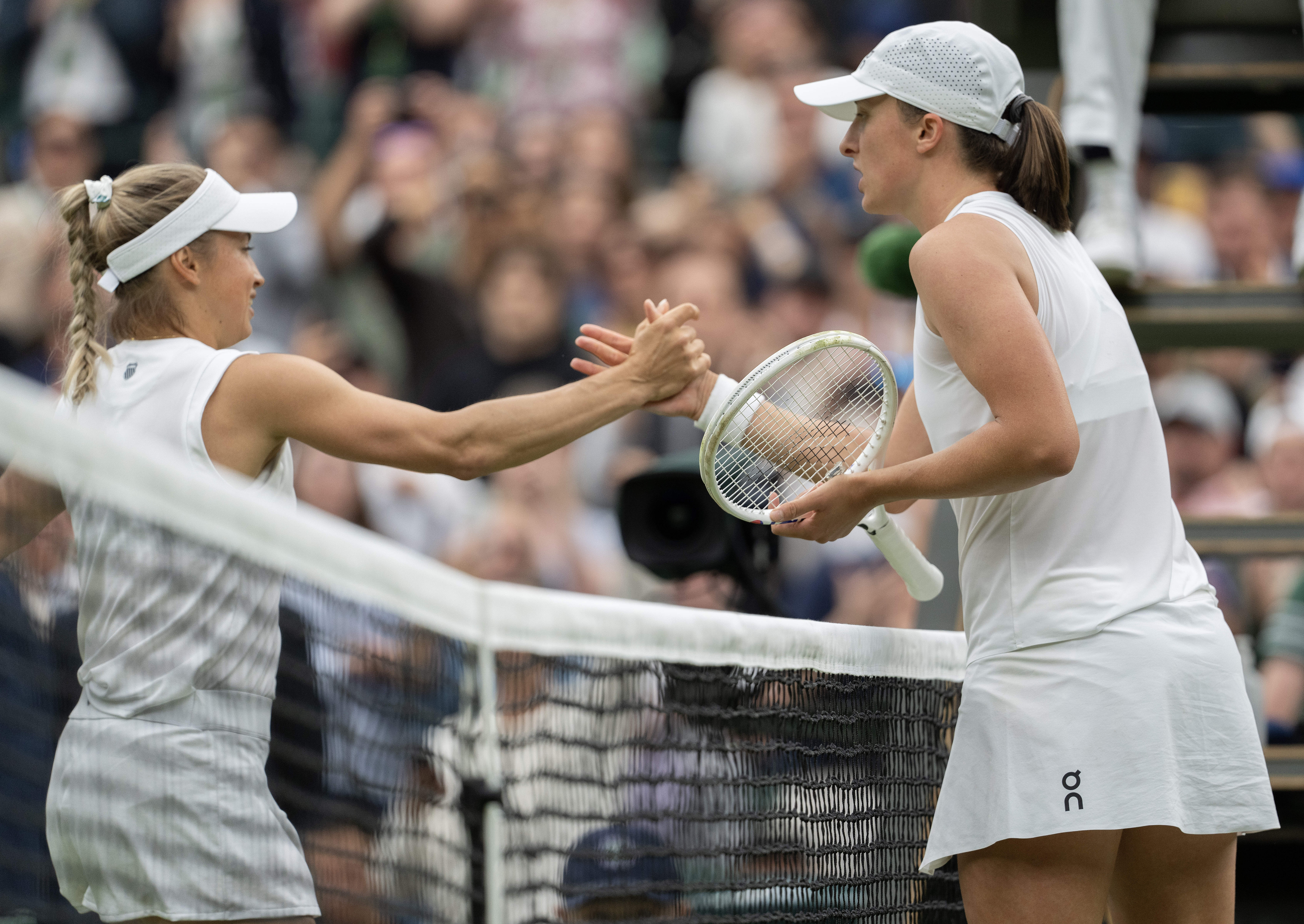 Another year of disappointment at Wimbledon for Iga Swiatek. Yulia Putintseva of Kazakhstan shakes hands after defeating Swiatek, right, in their third-round match on day six of The Championships at All England Lawn Tennis and Croquet Club