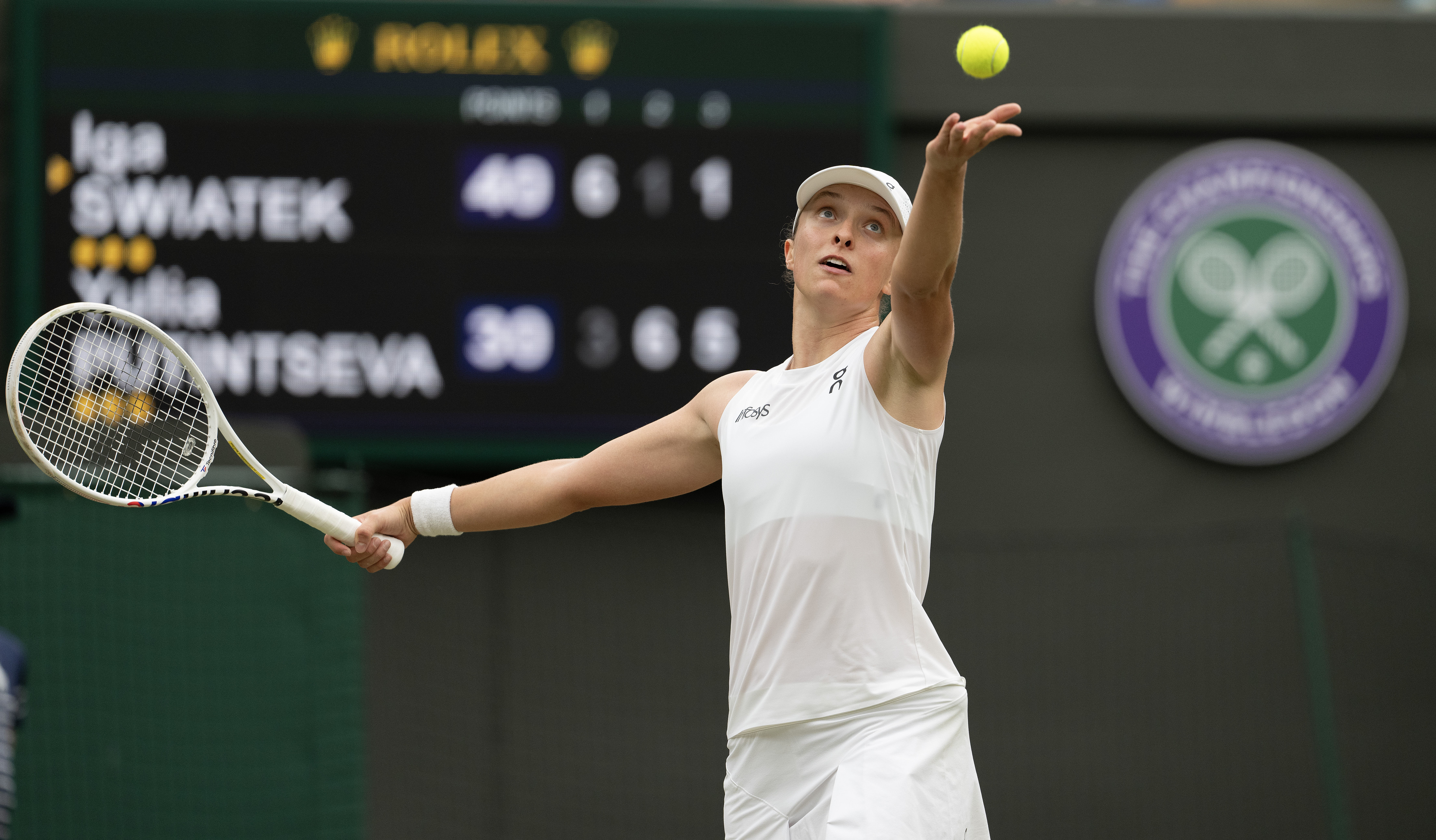 Jul 6, 2024; London,United Kingdom; Iga Swiatek of Poland tosses the ball to serve during her match against Yulia Putintseva of Kazakhstan on day six of The Championships at All England Lawn Tennis and Croquet Club. Mandatory Credit: Susan Mullane-USA TODAY Sports