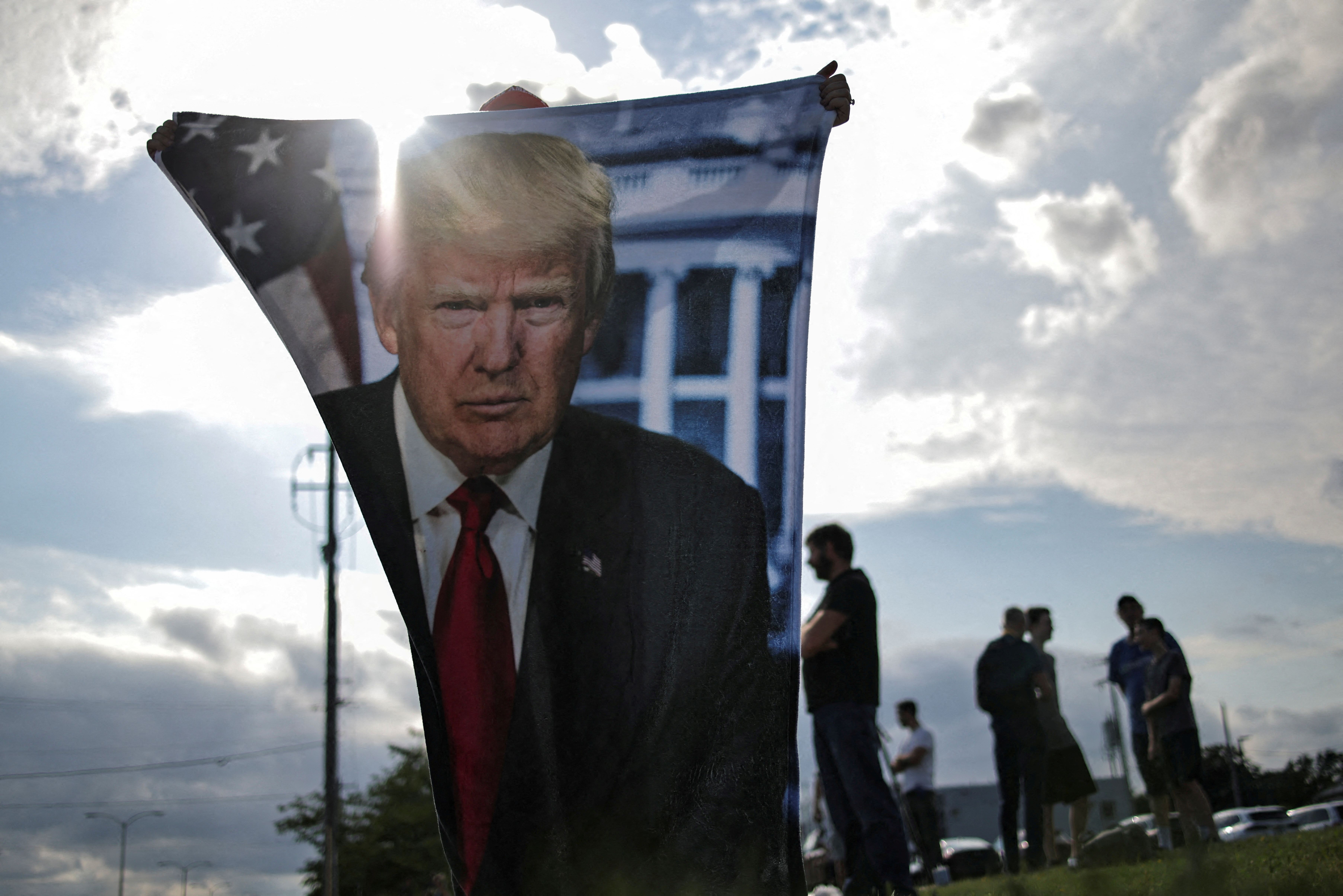 Supporters of Republican presidential candidate and former U.S. President Donald Trump wait for his arrival in Milwaukee, Wisconsin, U.S., July 14, 2024