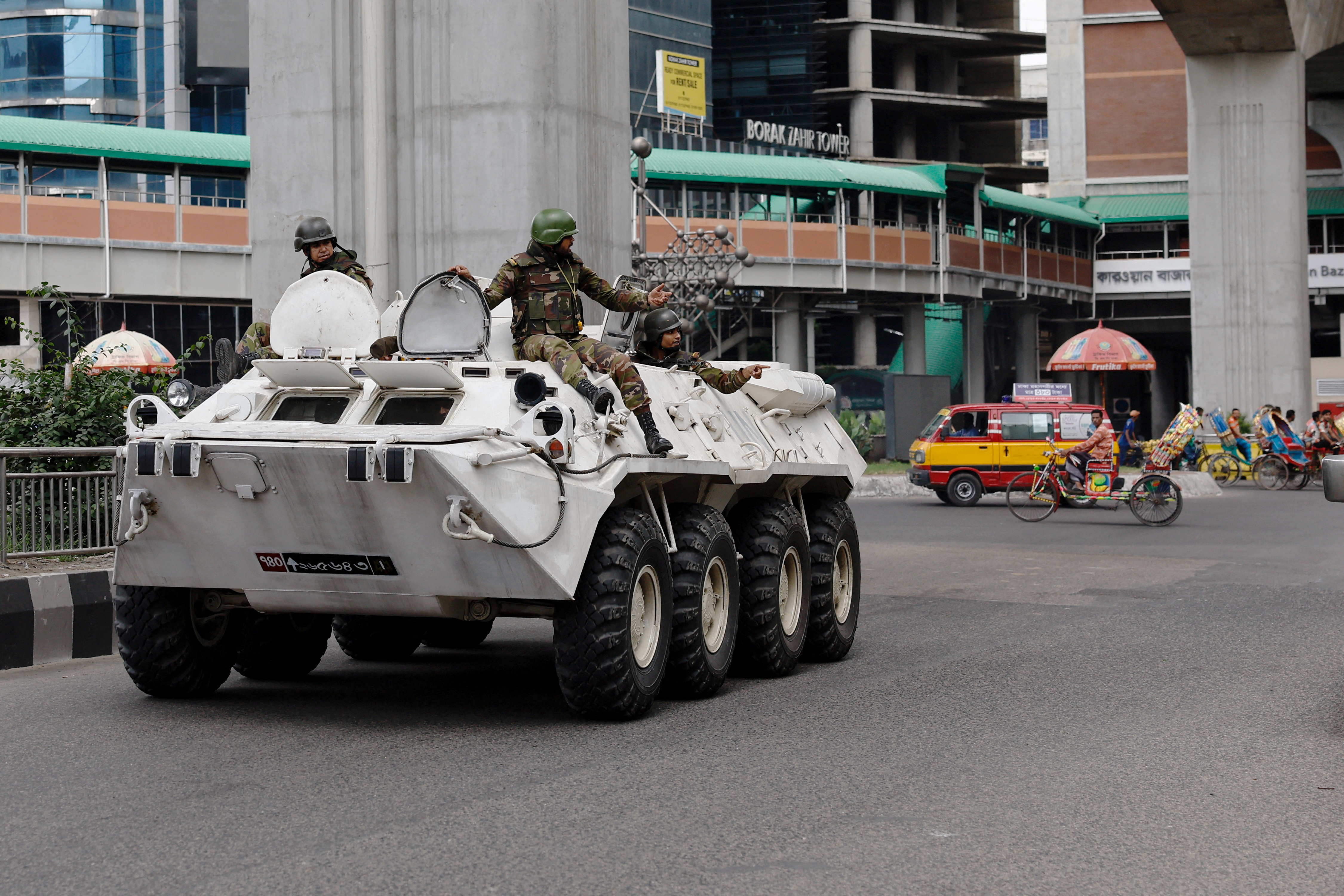 Soldiers in an armoured vehicle on patrol in Bangladesh's capital, Dhaka