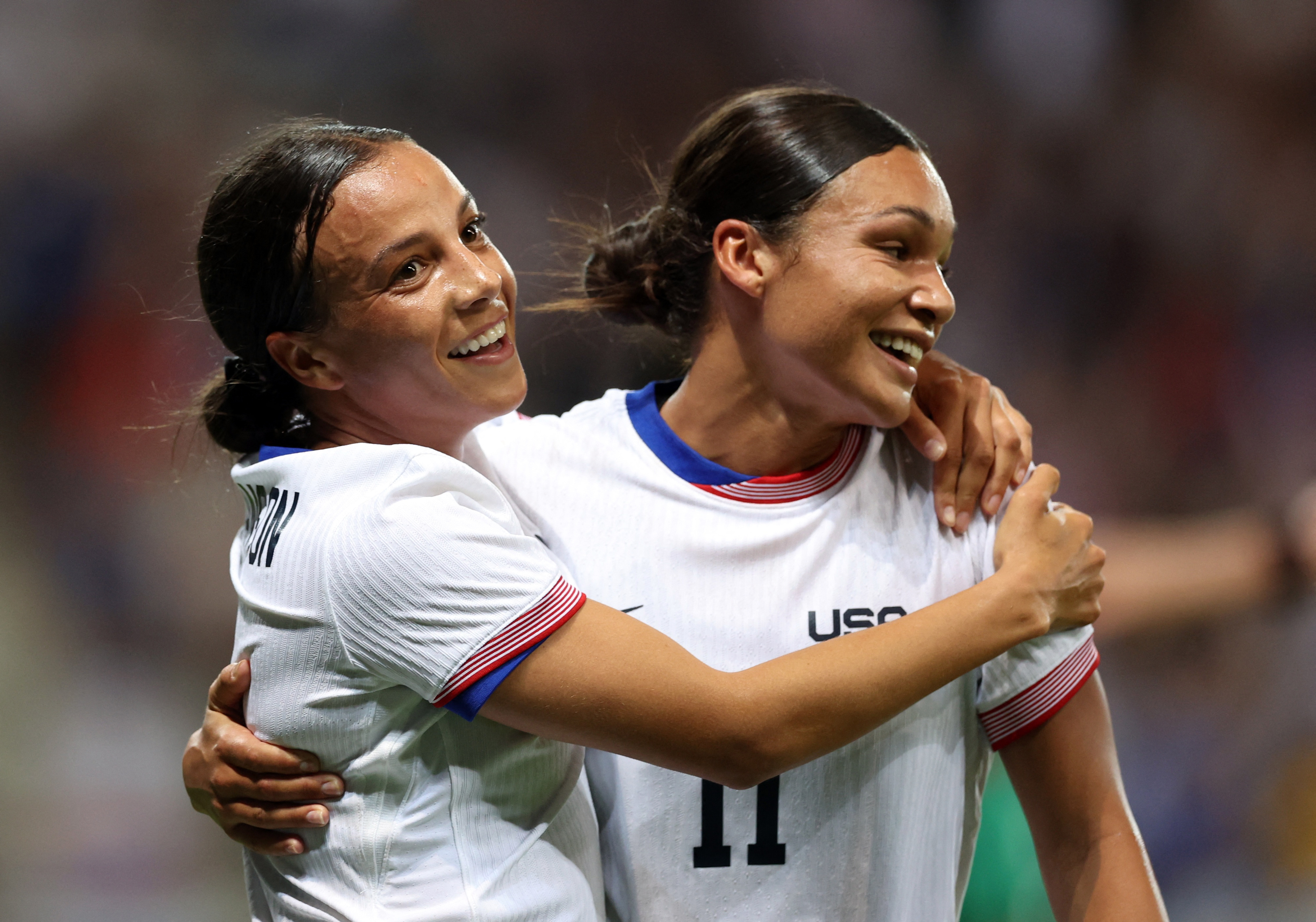 Paris 2024 Olympics - Football - Women's Group B - United States of America vs Zambia - Nice Stadium, Nice, France - July 25, 2024. Mallory Swanson of United States celebrates scoring a goal with Sophia Smith. REUTERS/Raquel Cunha