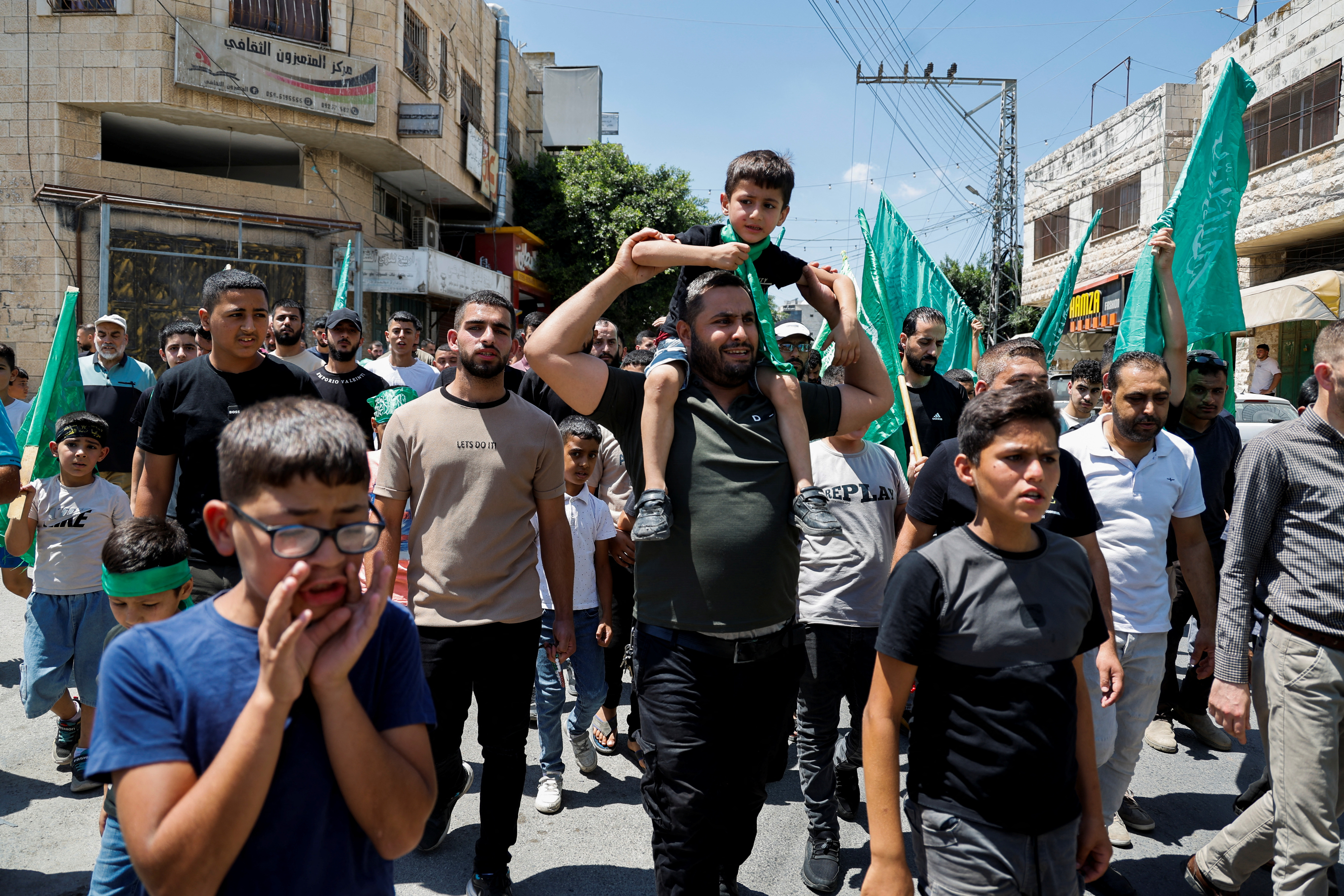 Palestinians attend a protest after the assassination of Hamas leader Ismail Haniyeh in Iran, in Tubas