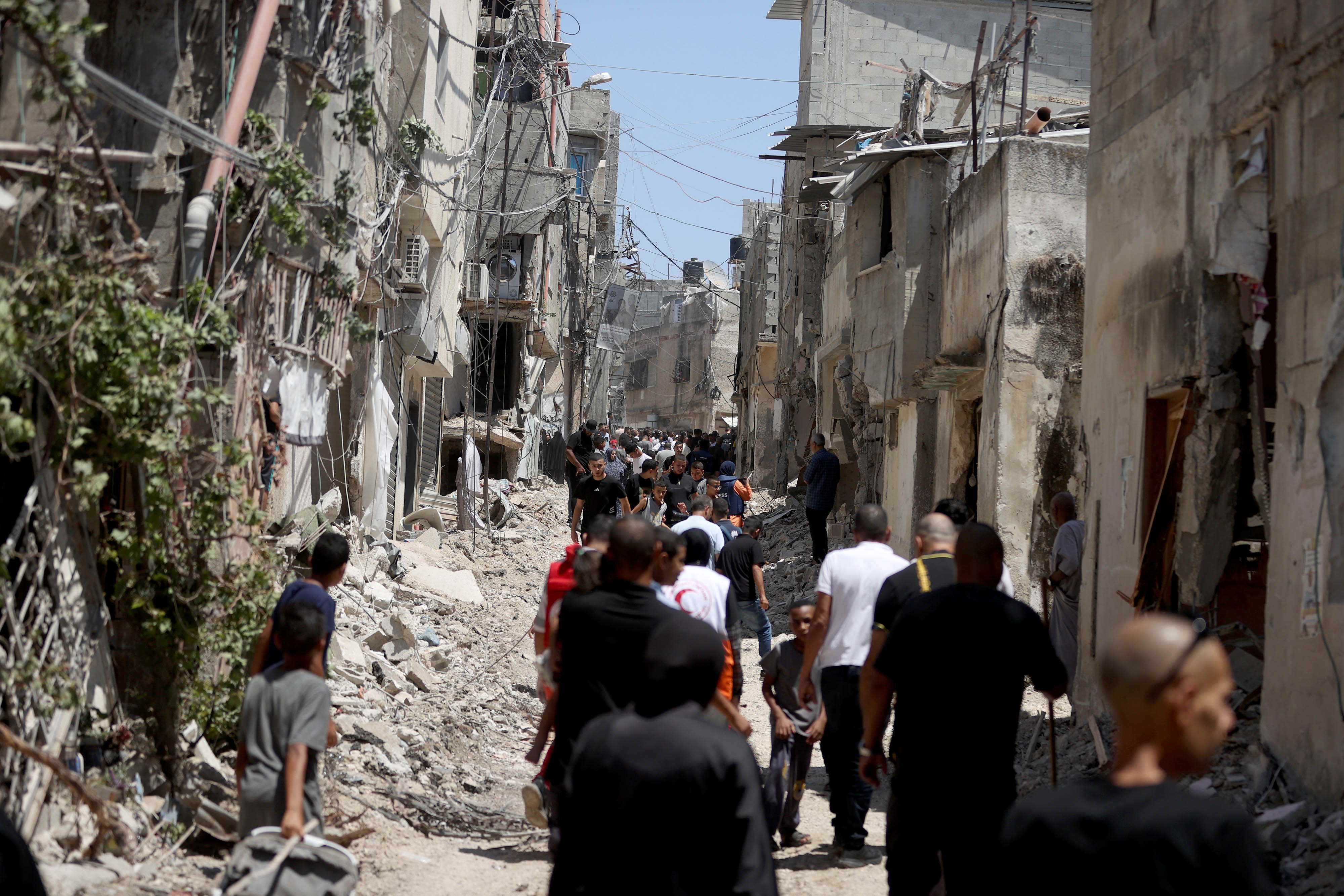 Palestinians inspect the area after the Israeli army withdrew from the Tulkarm Refugee Camp