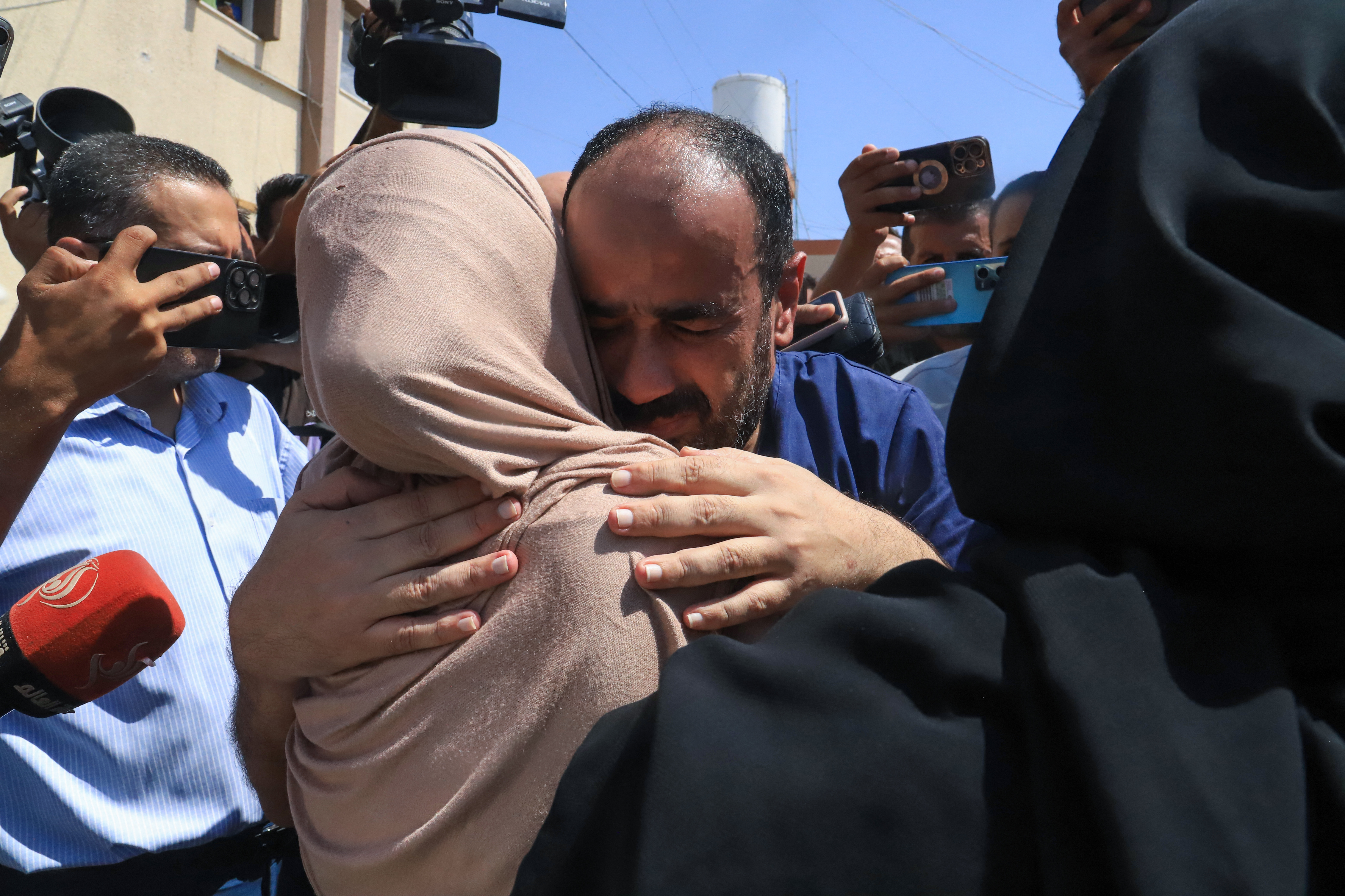 Al-Shifa Hospital Director Muhammad Abu Salmiya is welcomed by relatives after his release