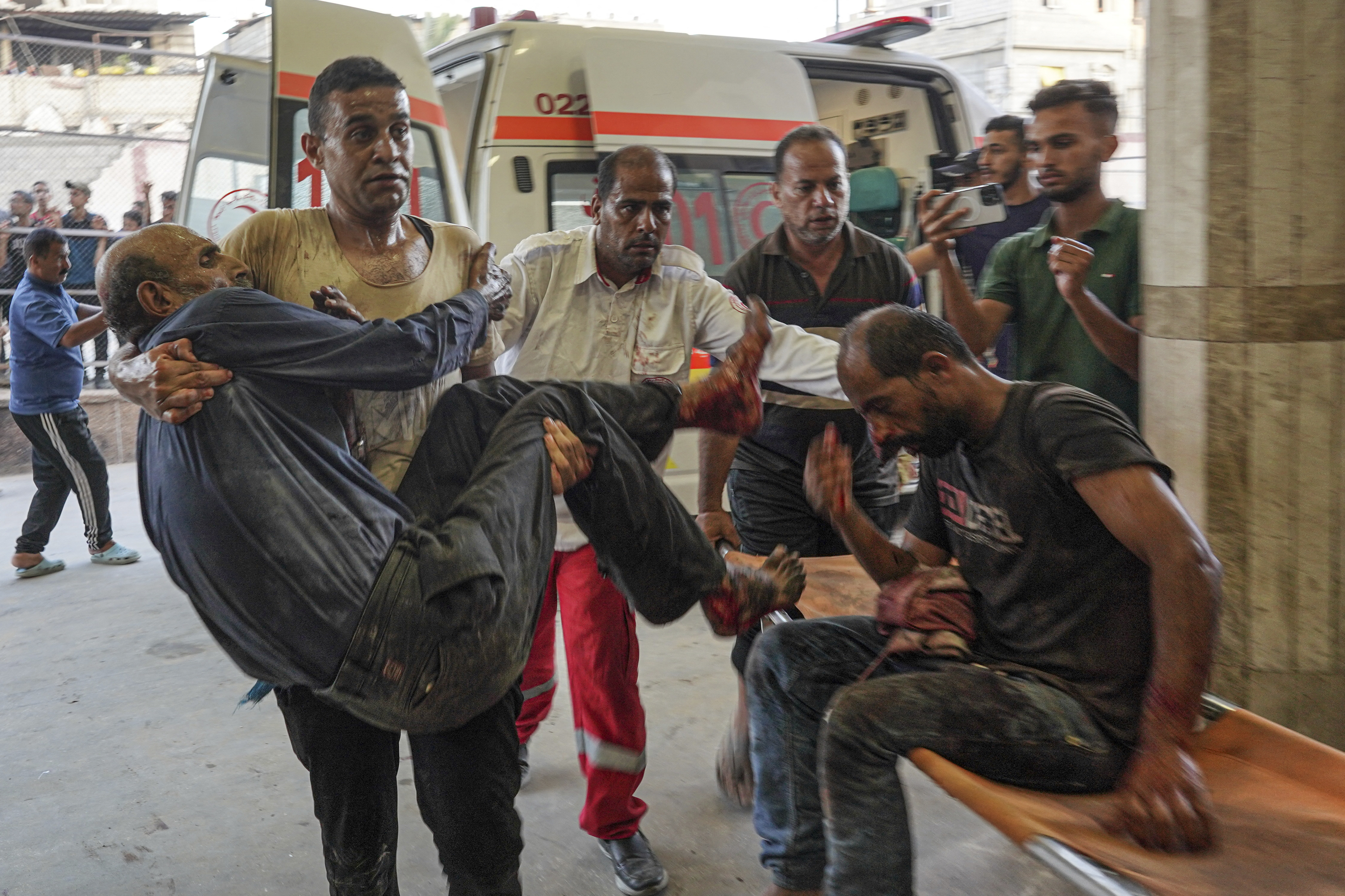 People injured during Israeli bombardment arrive at Nassr hospital in Khan Yunis, on the southern Gaza Strip on July 9, 2024.