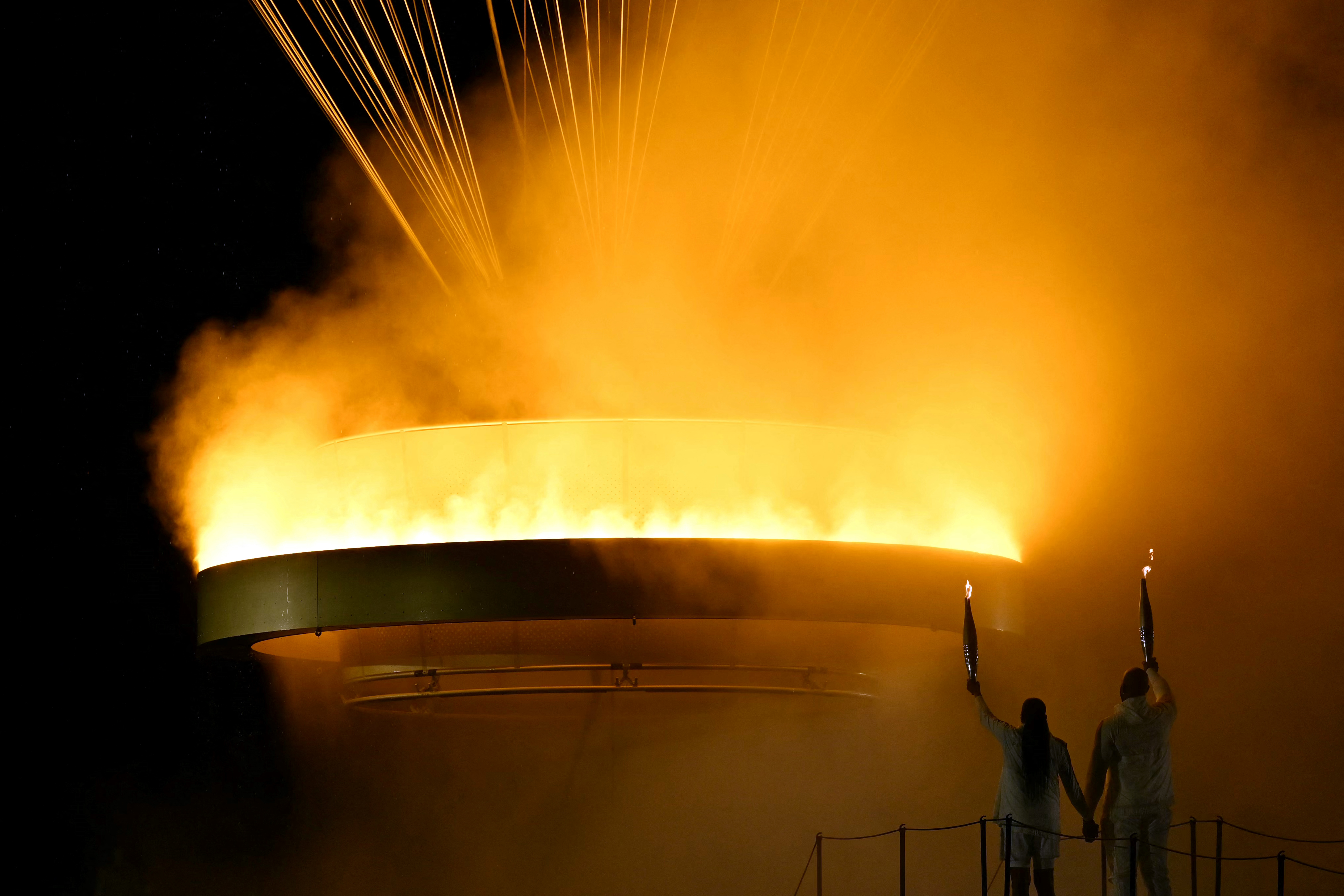Athletes light cauldron.