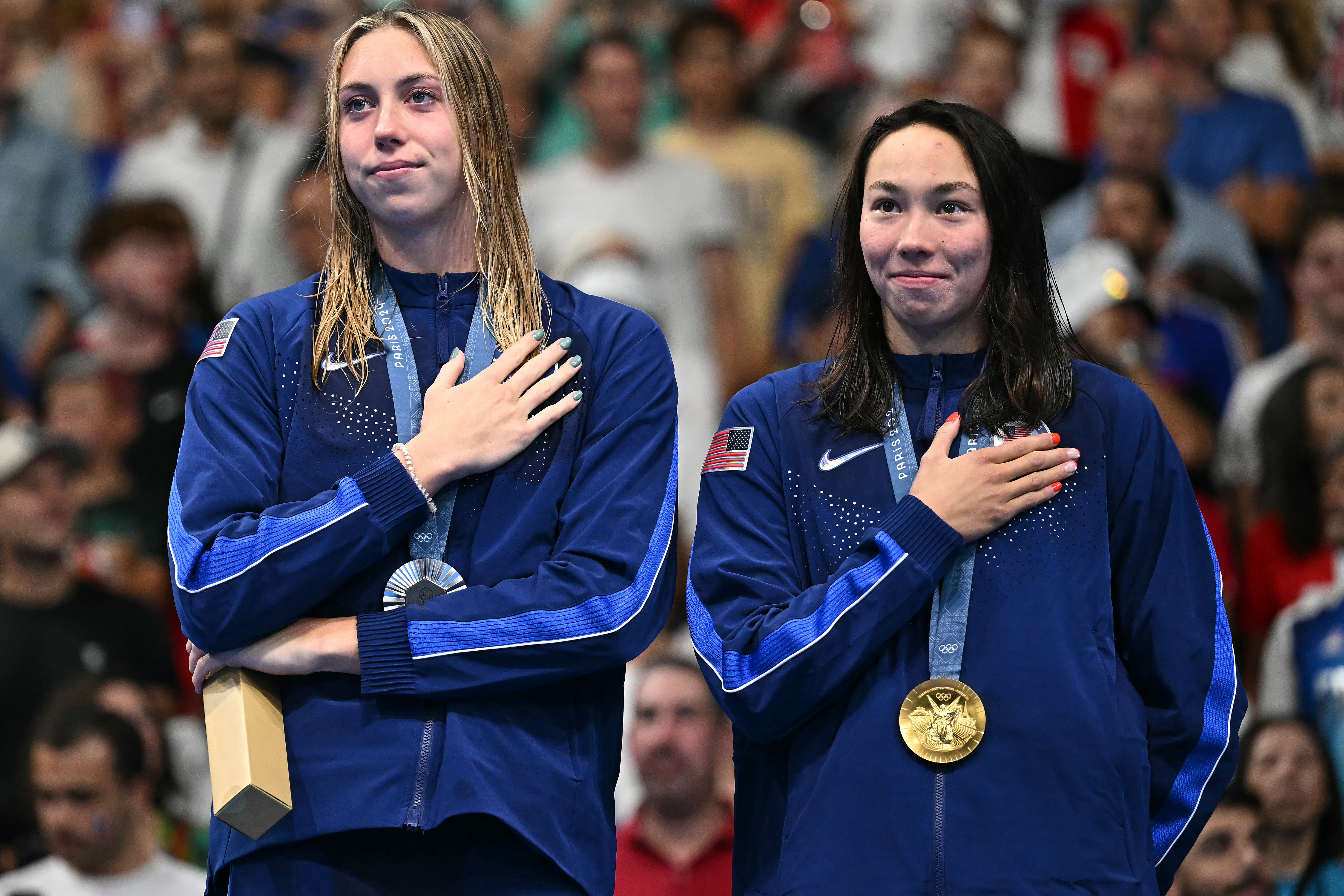 Two swimmers on medal dias.