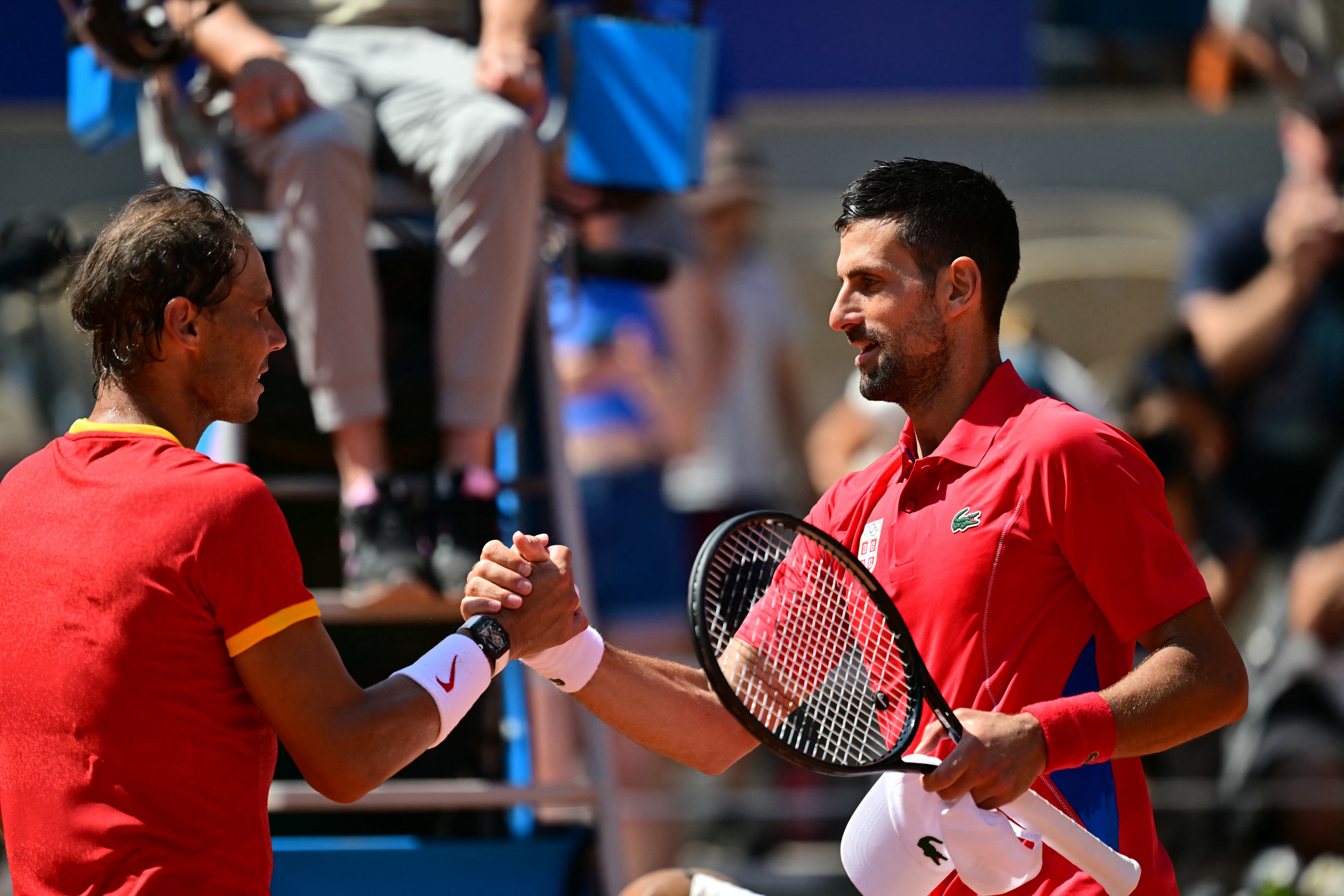 Tennis players shake hands.