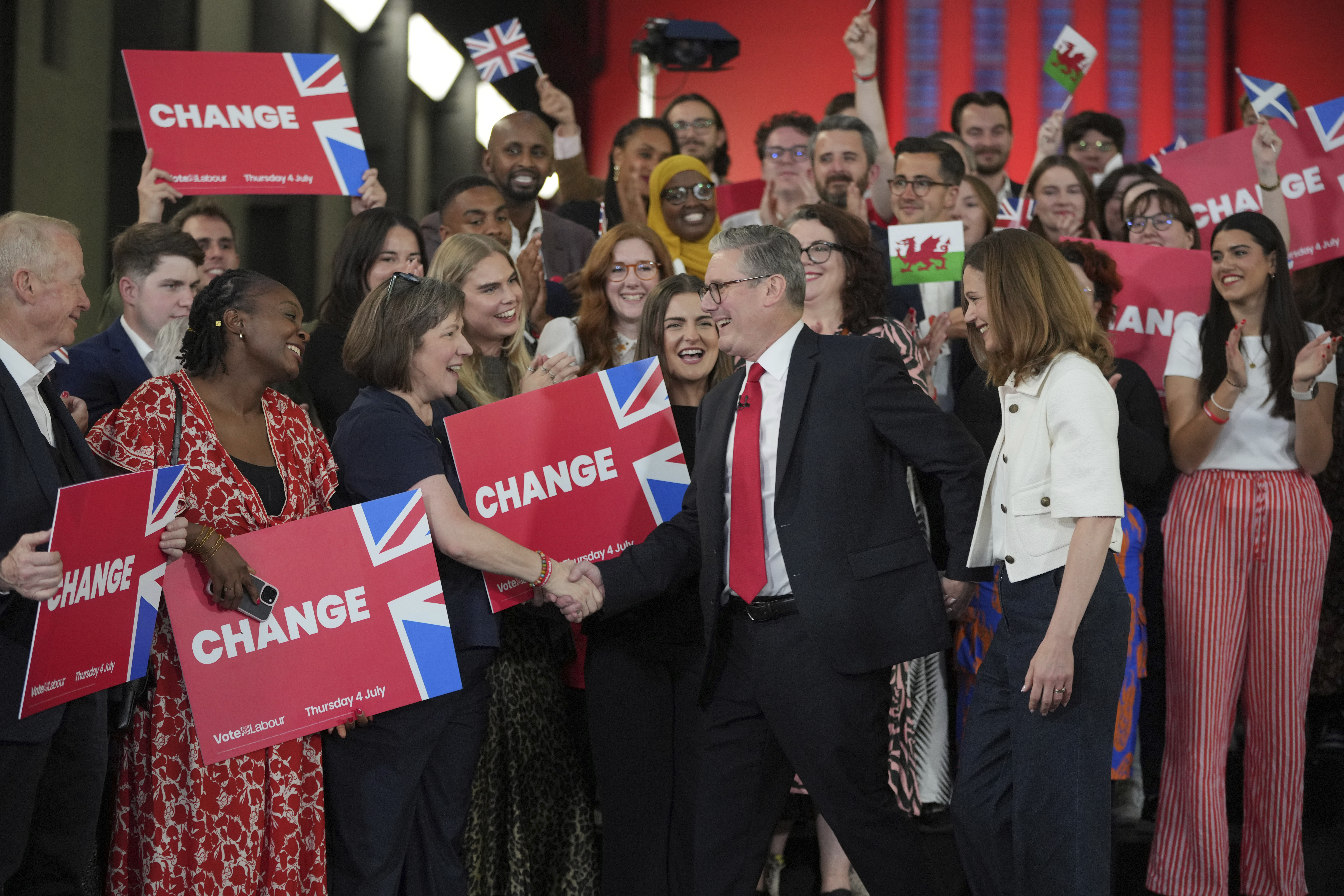Labour Party leader Keir Starmer shakes hands with his supporters at the Tate Modern in London